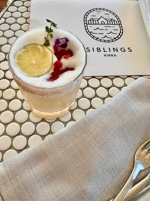 Relaxed holiday atmosphere at Kirra Point with surfers and families