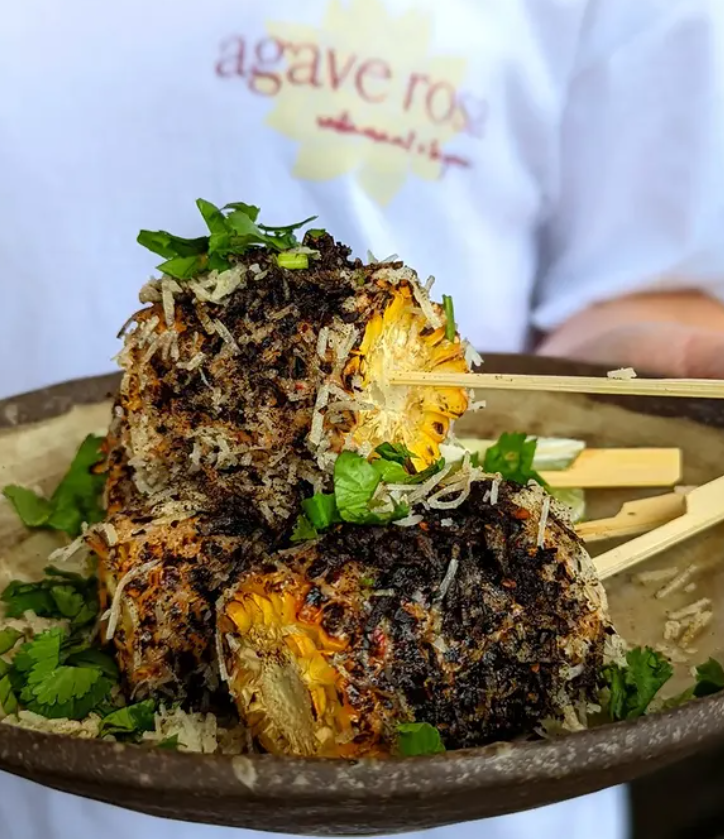 Relaxed holiday atmosphere at Kirra Point with surfers and families