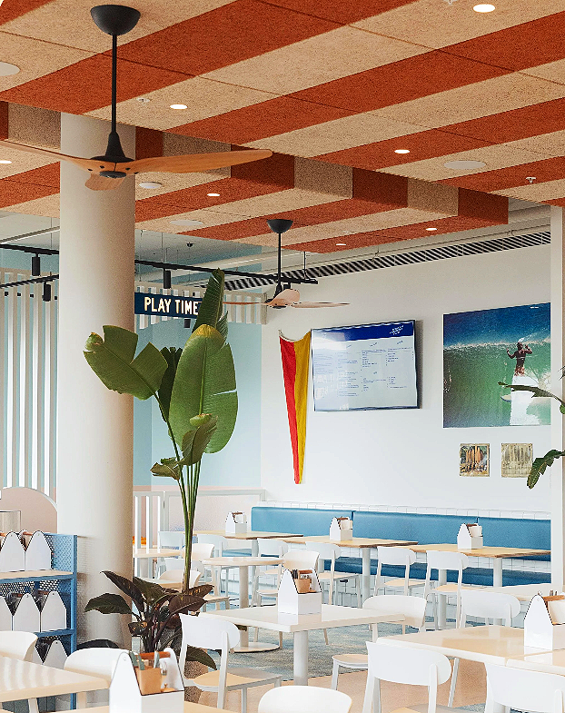 Relaxed holiday atmosphere at Kirra Point with surfers and families