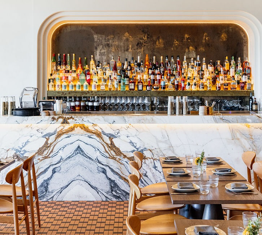 Relaxed holiday atmosphere at Kirra Point with surfers and families