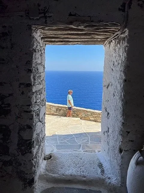 Scenic alleys of Sifnos village overlooking the Aegean Sea