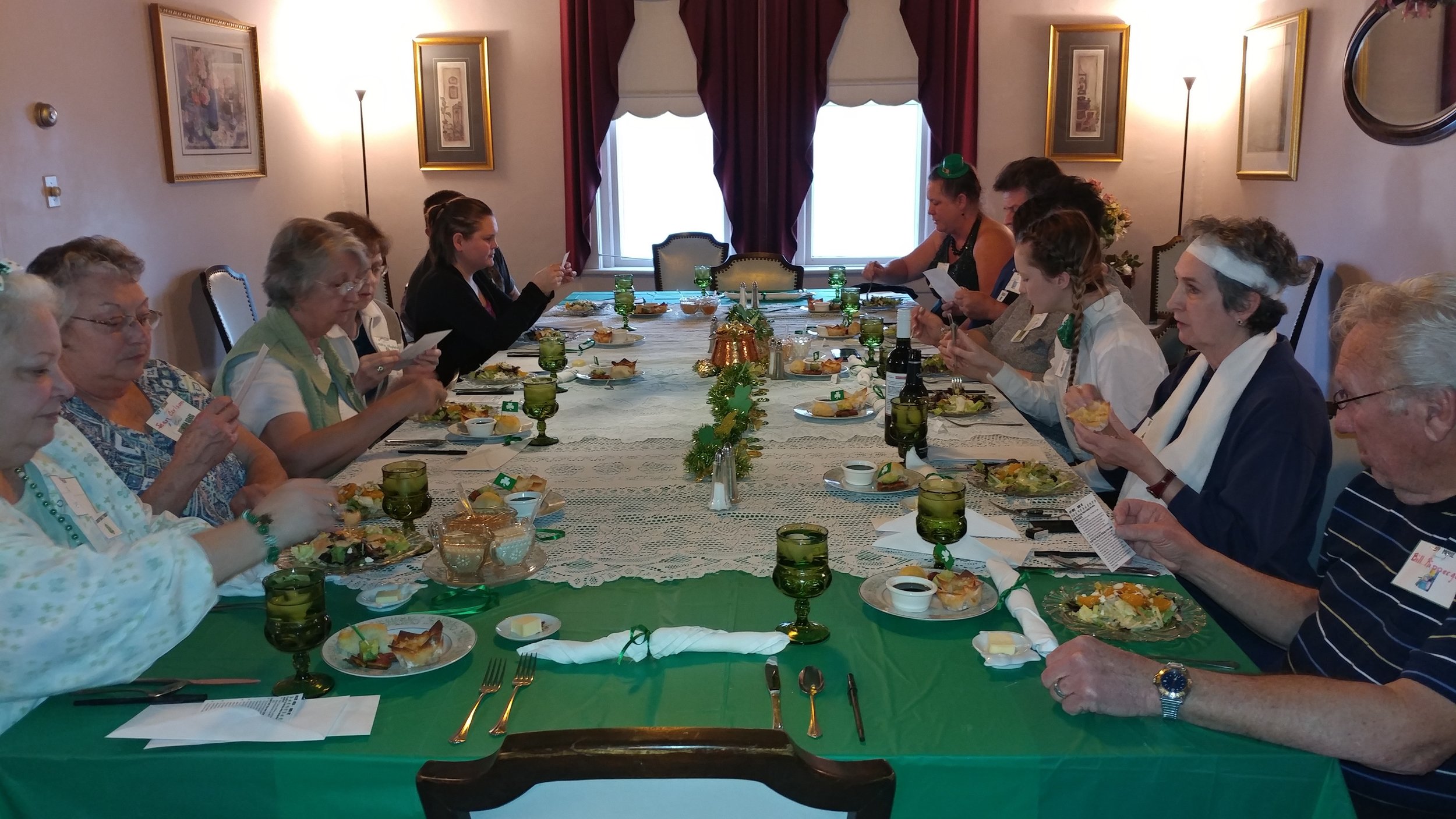  Dinner guest's reading up on their characters. 