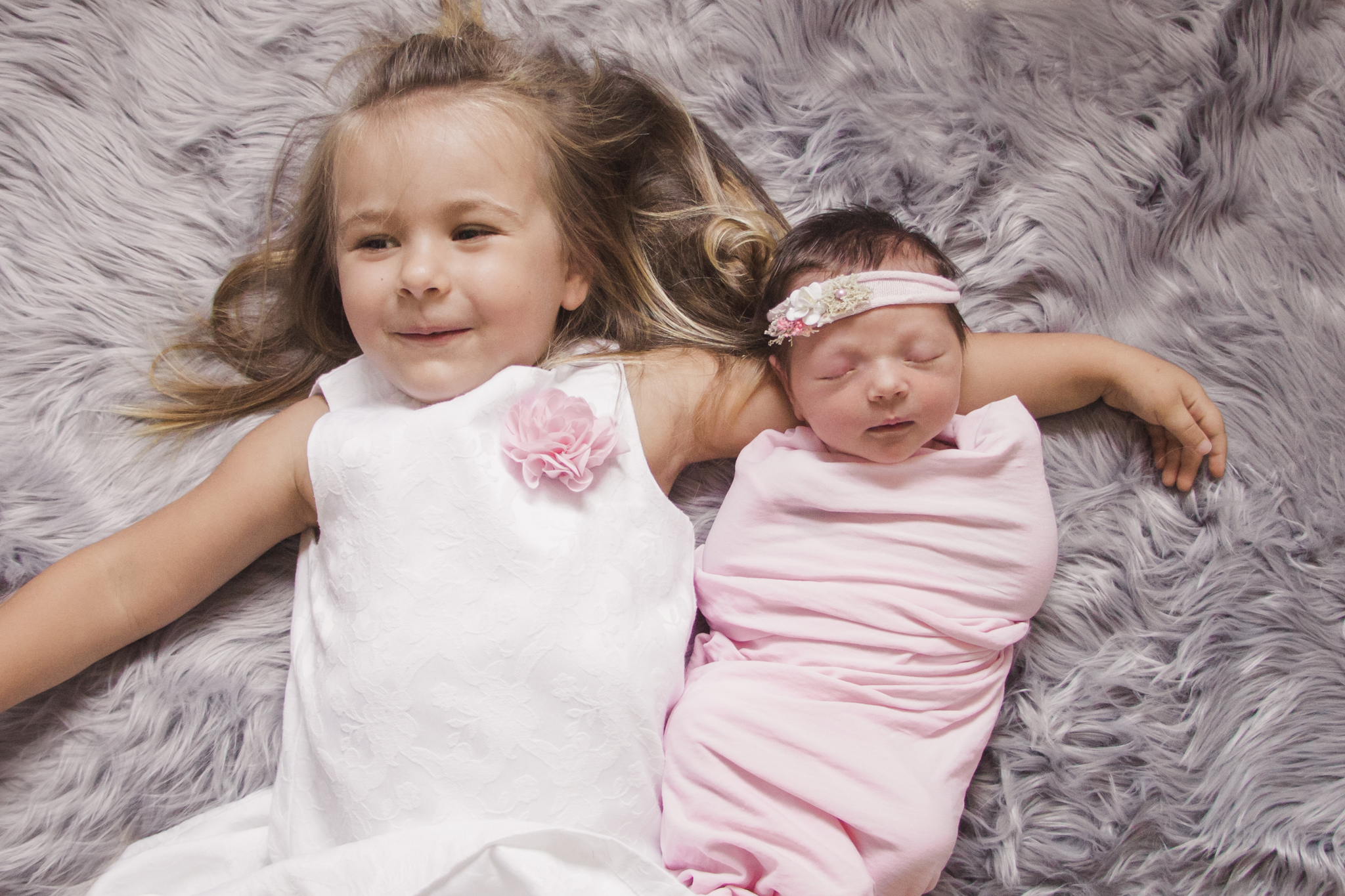 newborn with sister