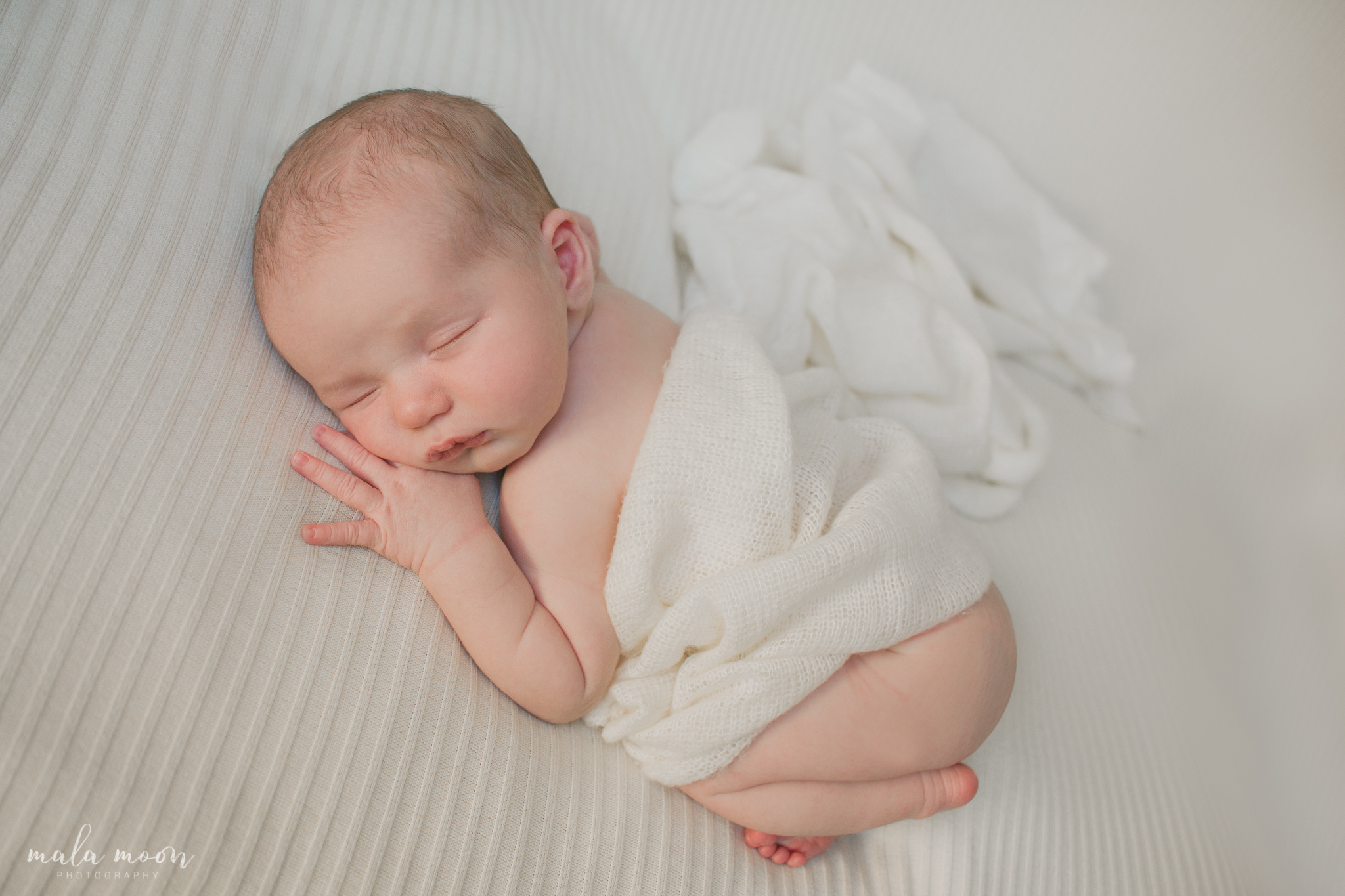 baby-boy-sleeping-wrap-on-tummy