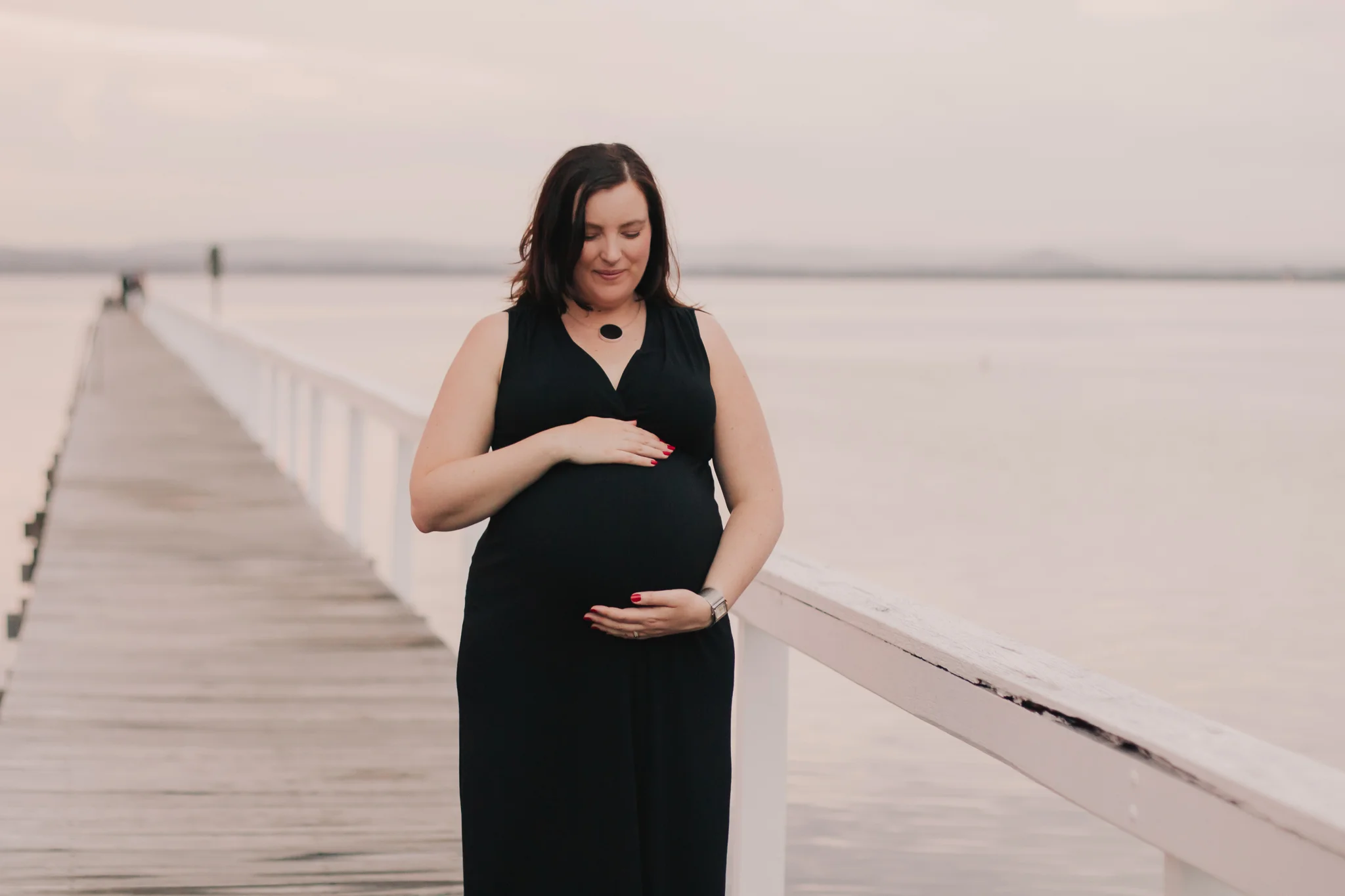 pregnancy session with mum holding her bump