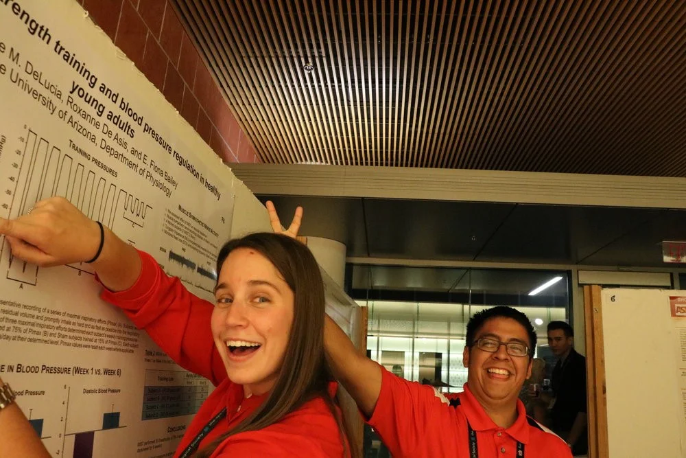 Claire DeLucia and Luis Cruz having some fun during the poster session at the 2016 Annual Meeting.