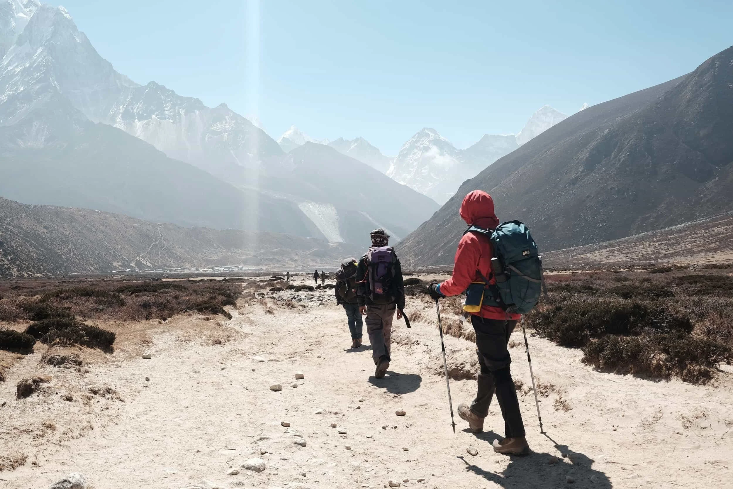 Hikers hiking a worn out trail in Nepal