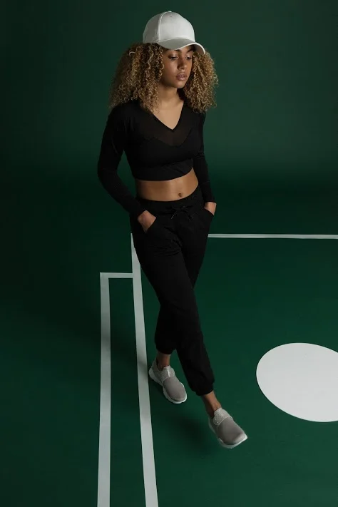 Top, Varley | Jogging bottoms, LNDR | Trainers, Nike | Cap, stylist's own