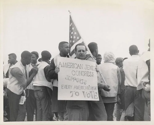 American Jewish Congress member holds sign at Montgomery March, 1965. Photograph, American Jewish Historical Society, 1965.