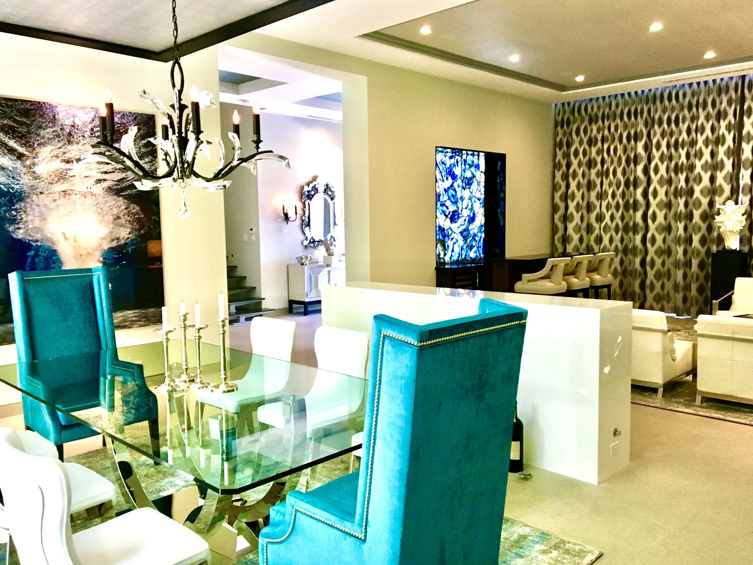 luxury great room with dining area has custom blue chairs and bar with blue agate in Fort Lauderdale