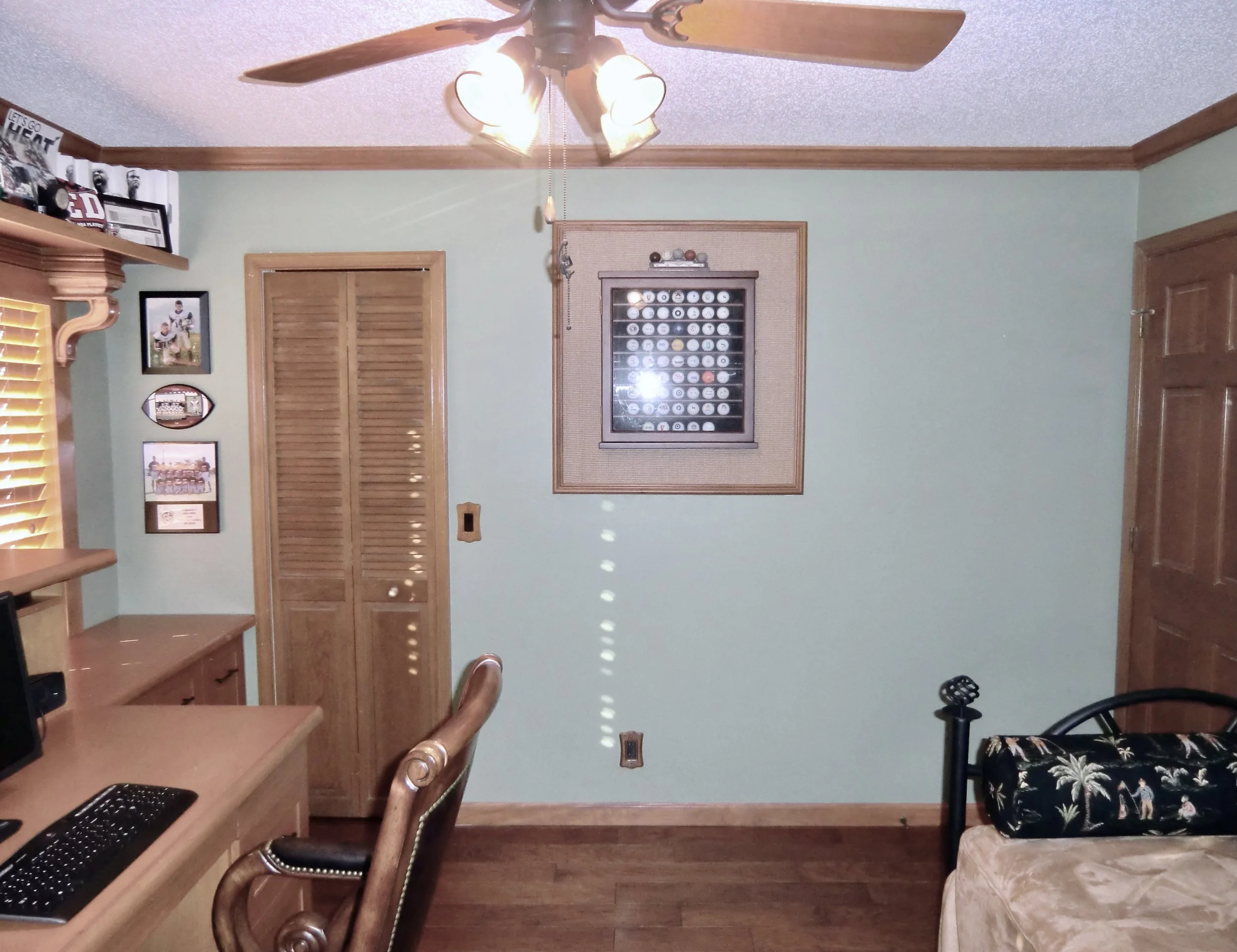 transitional home office with golf memorabilia in Delray Beach