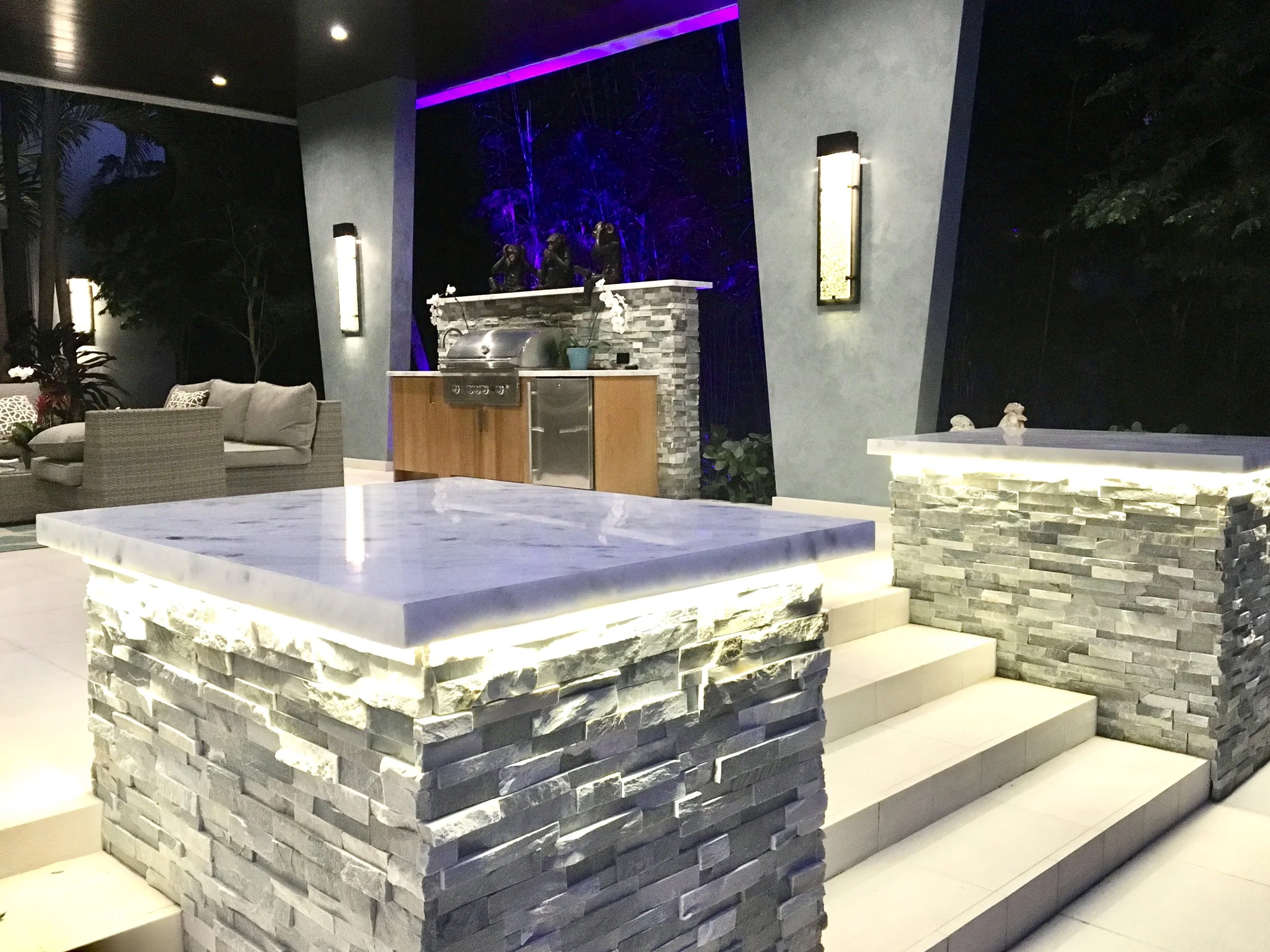 modern tropical zen patio with stone columns and LED lights