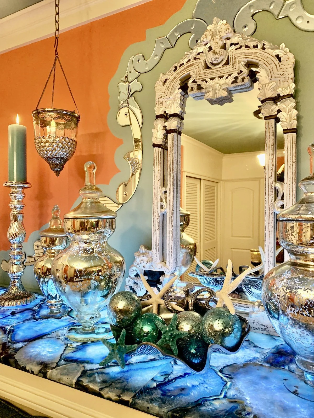 Colorful Mediterranean media room with Venetian mirror and blue agate countertop with LED lighting