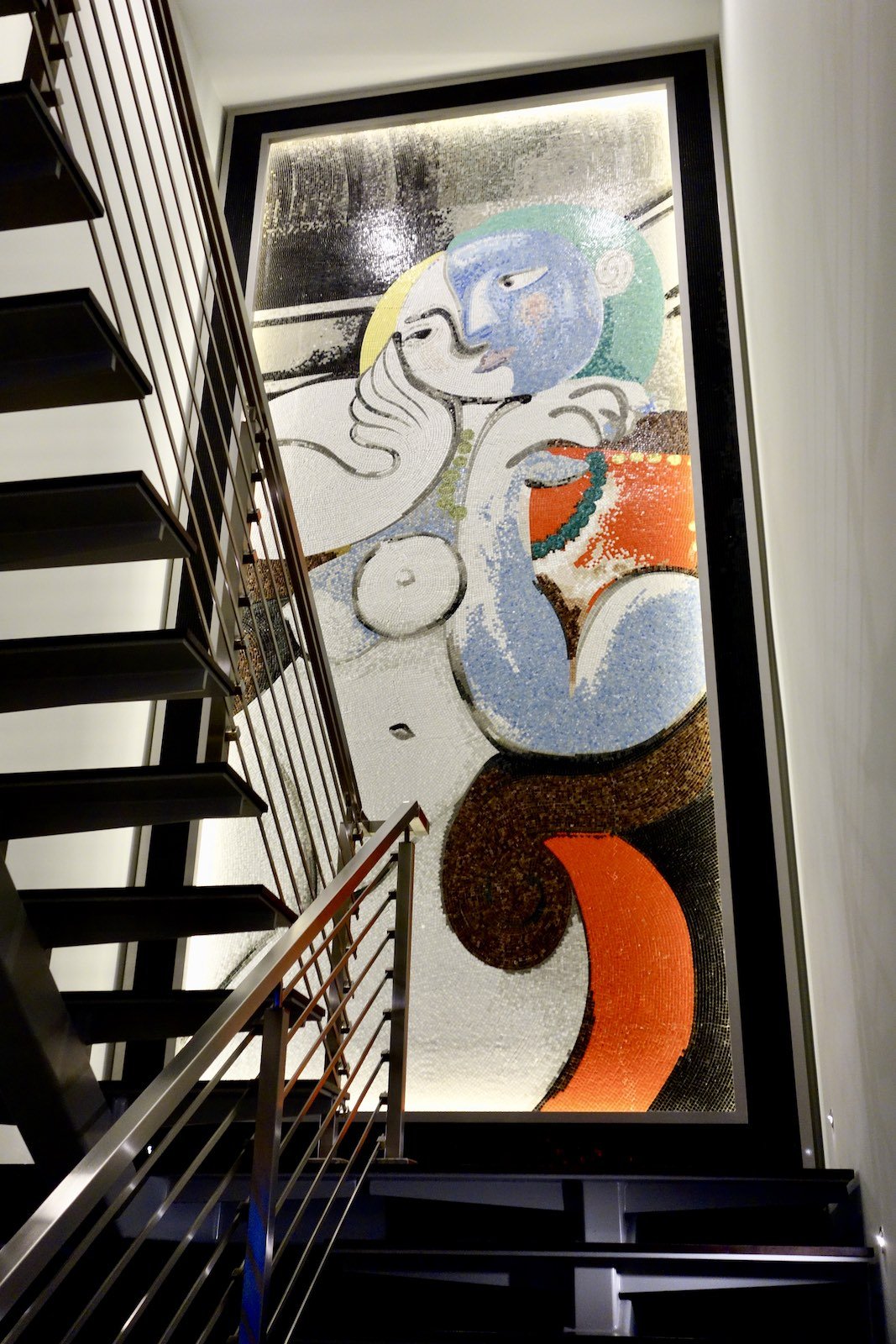 twenty foot tall glass Mosaic of Picasso's woman in red chair in Fort Lauderdale