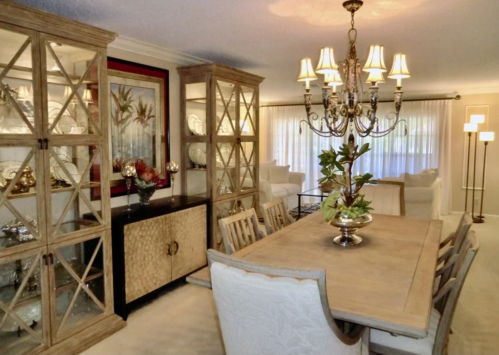 coastal Bahama style dining room with rustic table and armoire in Delray Beach