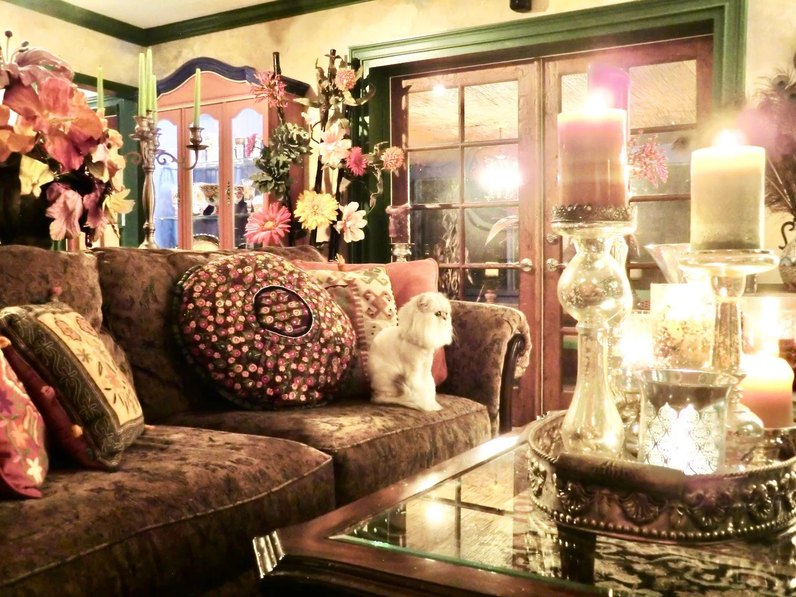 Mediterranean style home remodel of living room with rustic walls and green moldings