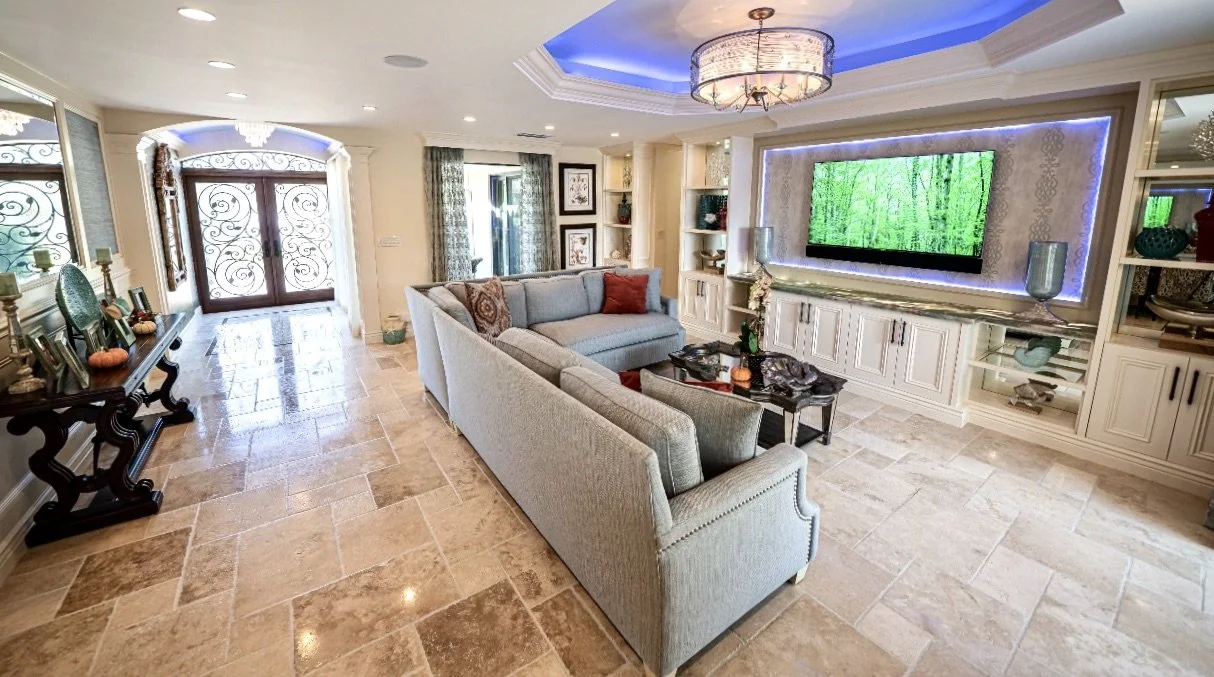 traditional coastal style of living room with wrought iron doors in Fort Lauderdale