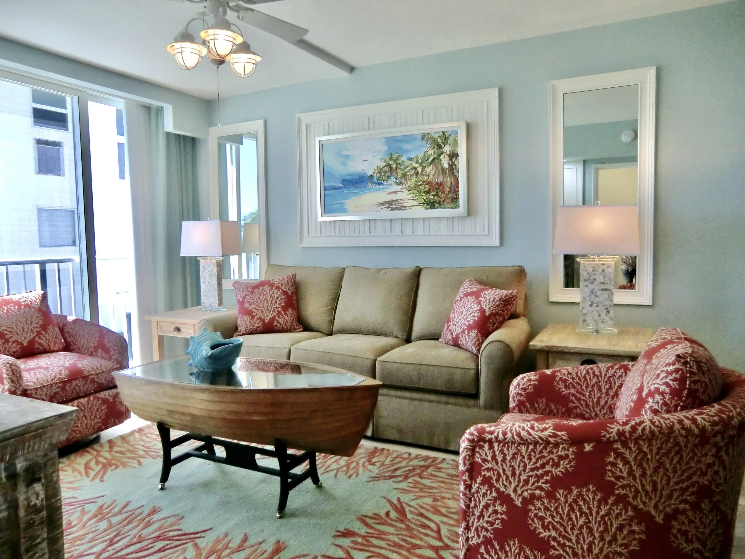 tropical colorful living room with red coral chairs and rug in the Florida Keys
