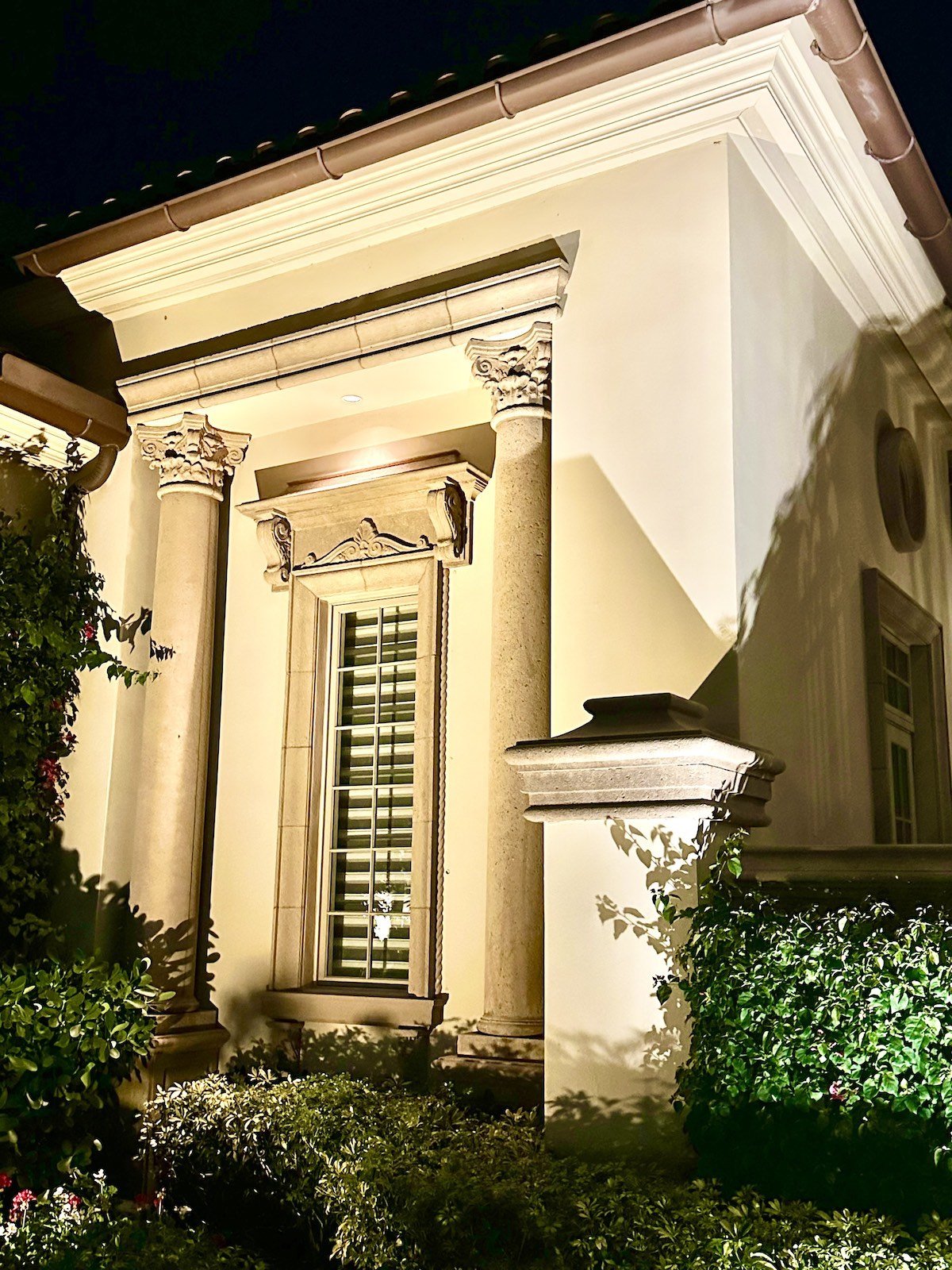 Mediterranean stone columns and molding around window in Jupiter