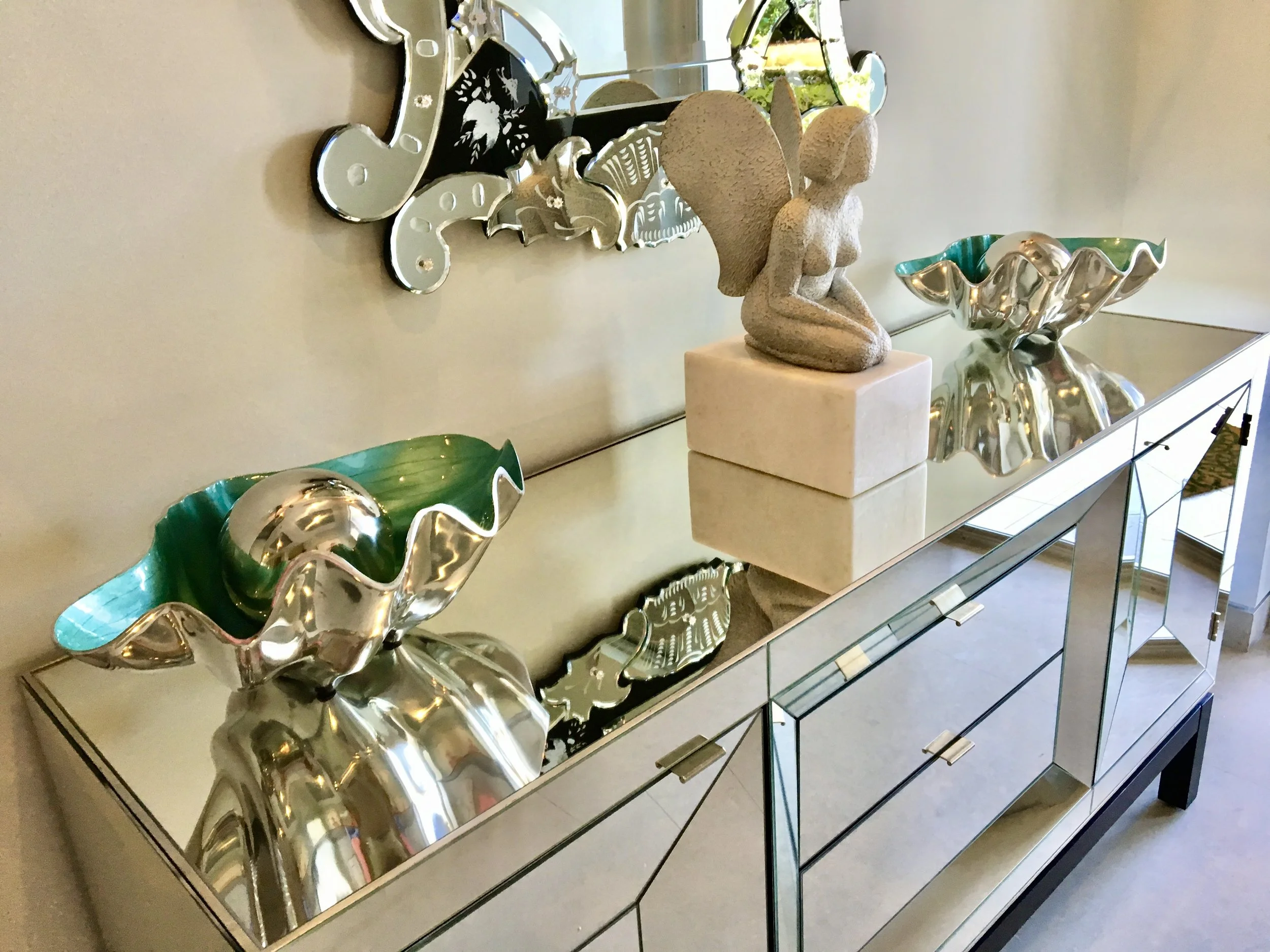 luxury modern foyer with stone angel and mirror table