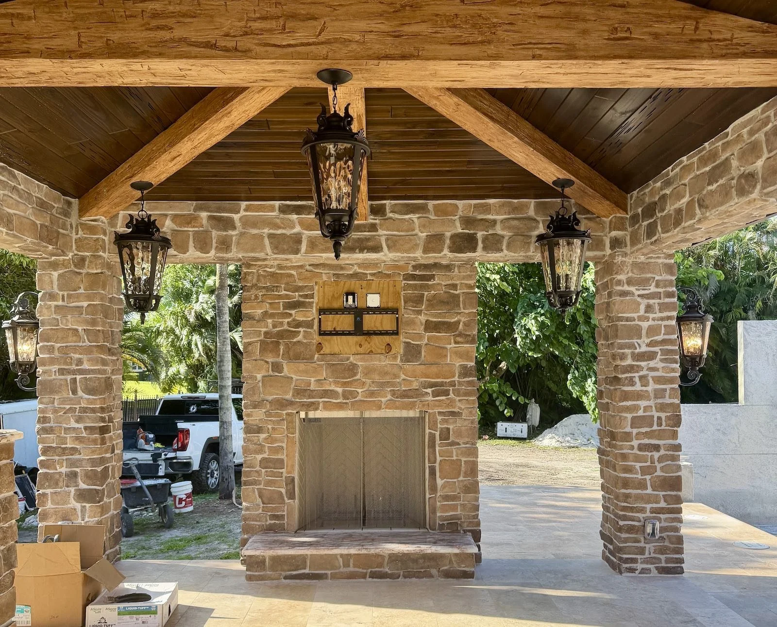 old world Mediterranean luxury pool gazebo with stone fireplace
