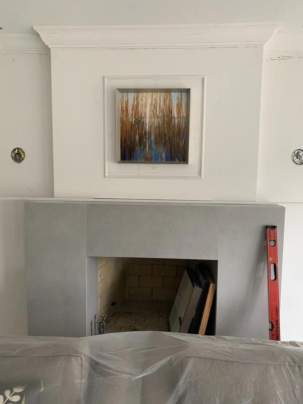remodel of transitional modern fireplace with picture frame