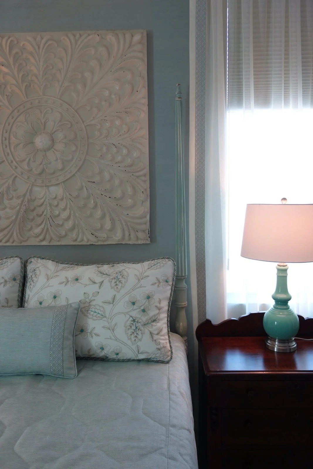 modern coastal style aqua bedroom with four poster bed in Fort Lauderdale