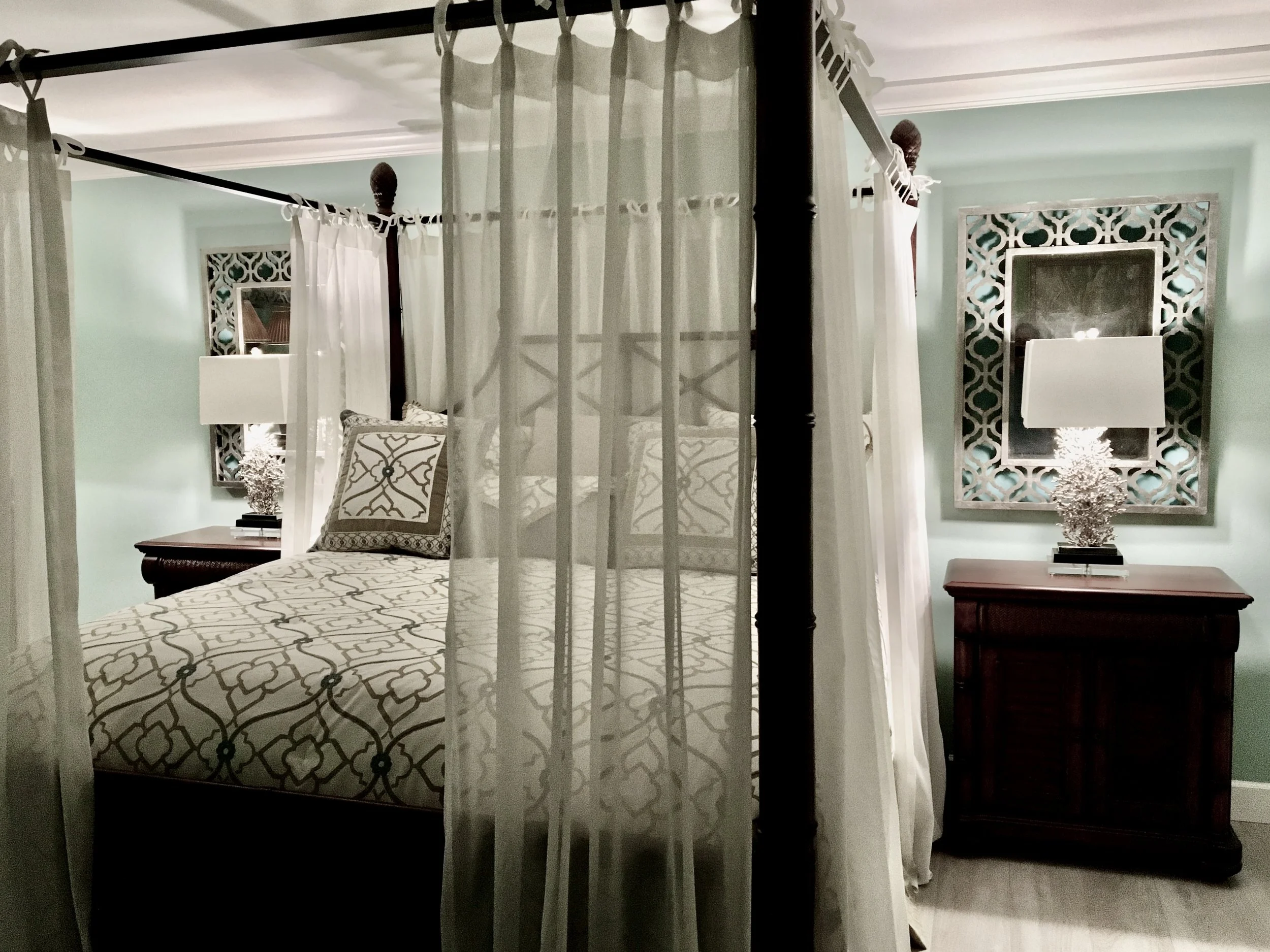 British Colonial Bahamas Style bedroom with a four poster bed with drapes