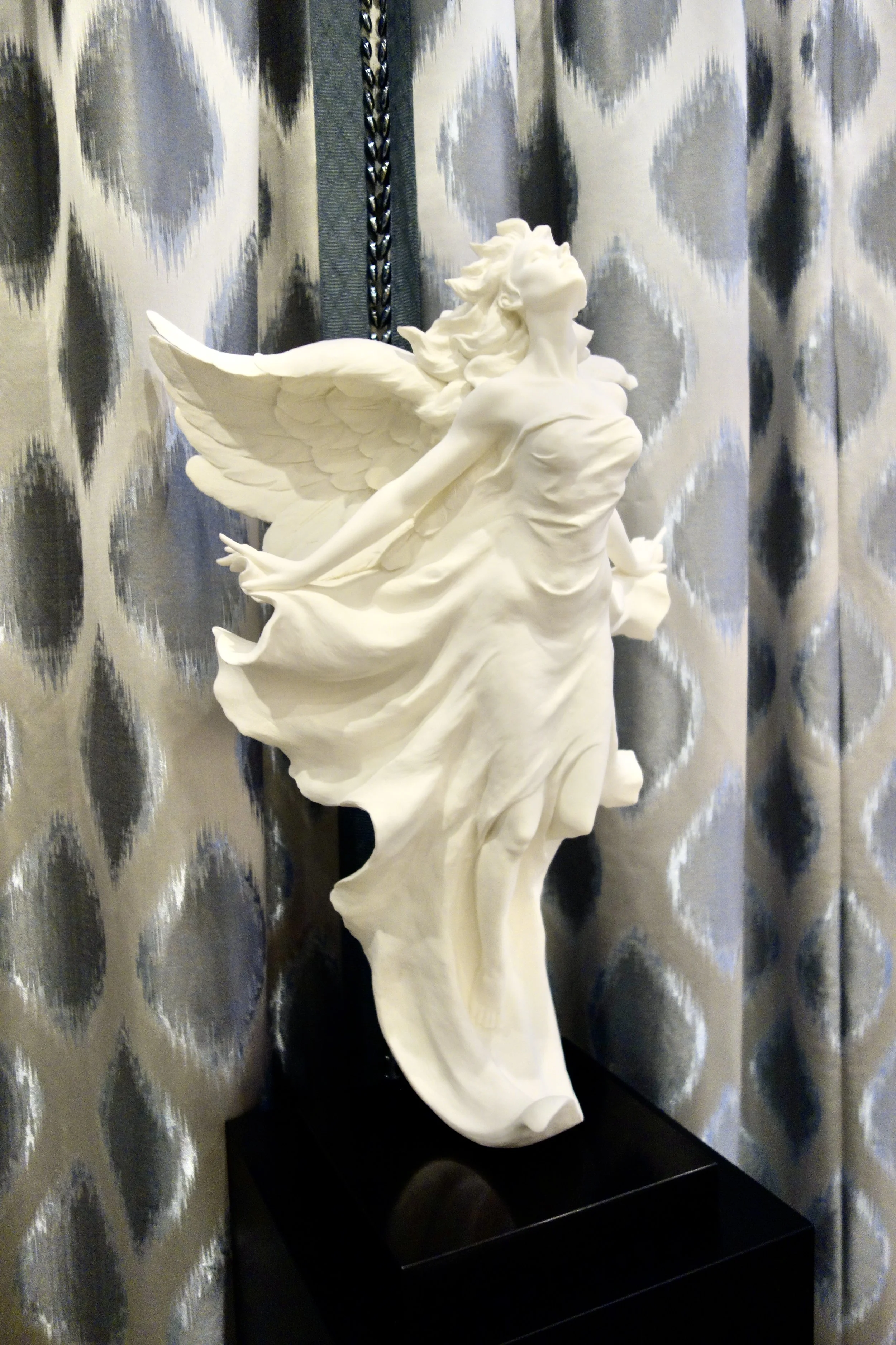 large carved white angel statue