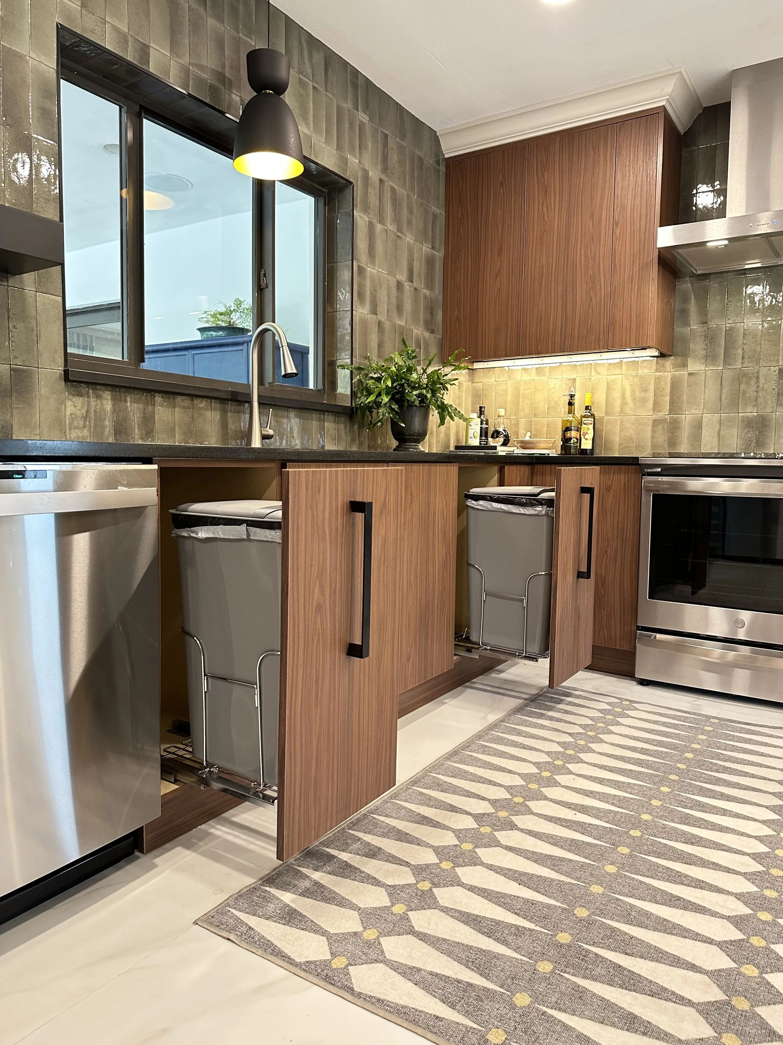 Modern custom kitchen with two pull-out trash bins in Fort Lauderdale