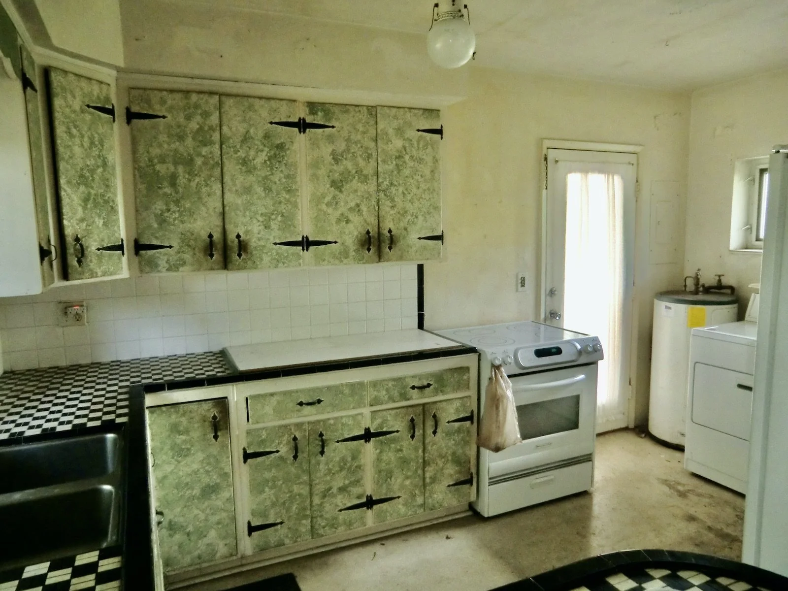 before of kitchen remodel of modern black and white kitchen