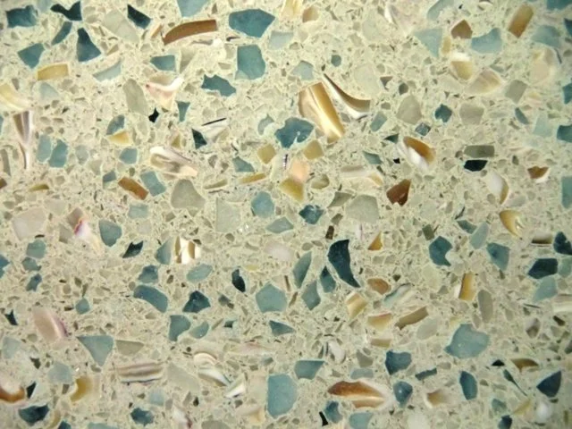 Modern coastal kitchen with vetrazzo quartz stone counters at Ocean Reef Club