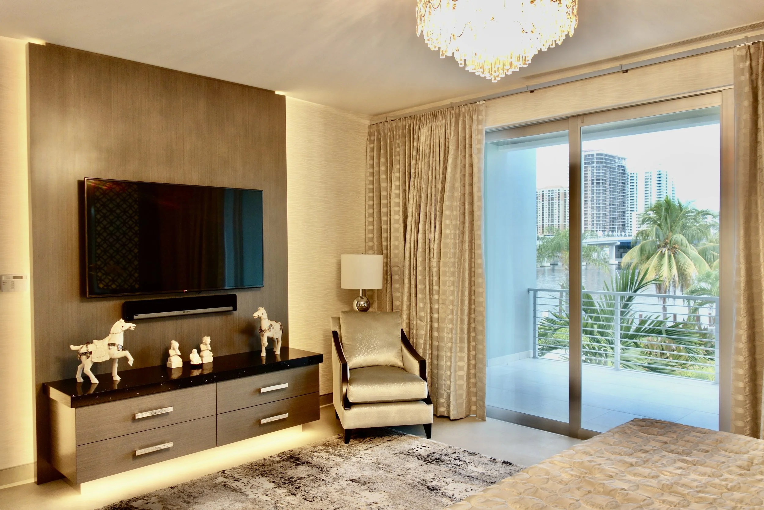 luxury modern primary master bedroom with custom cabinets and LED lights