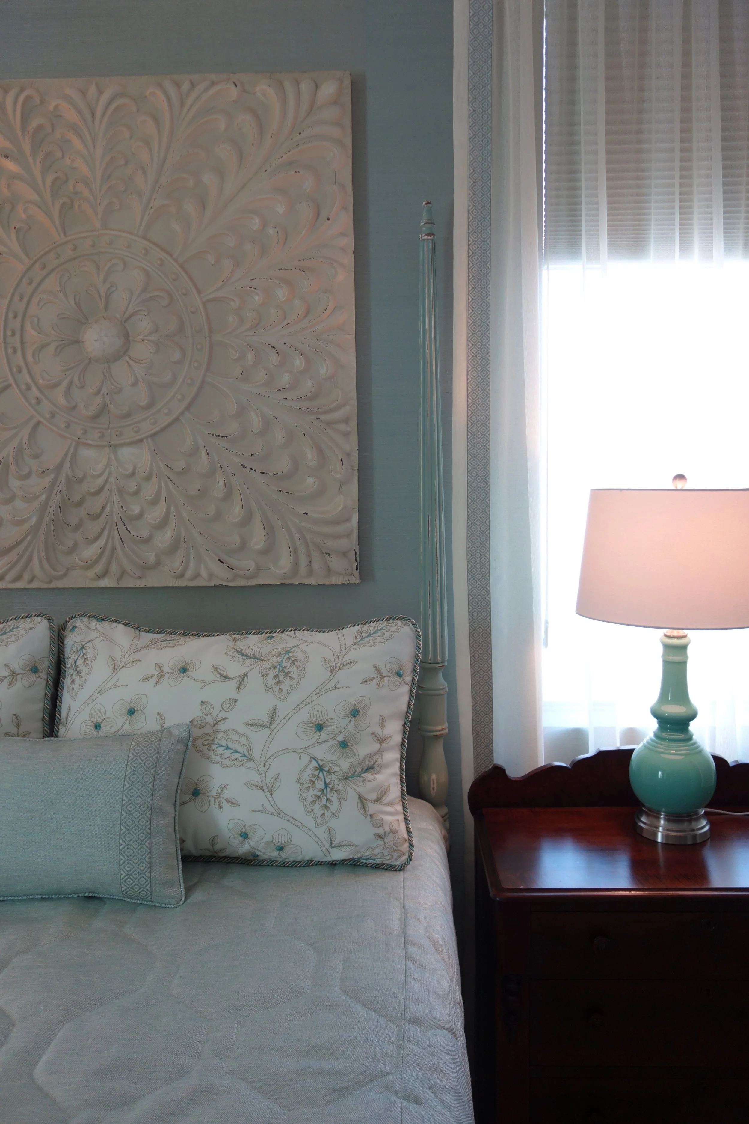 modern coastal style bedroom in aqua with four poster bed