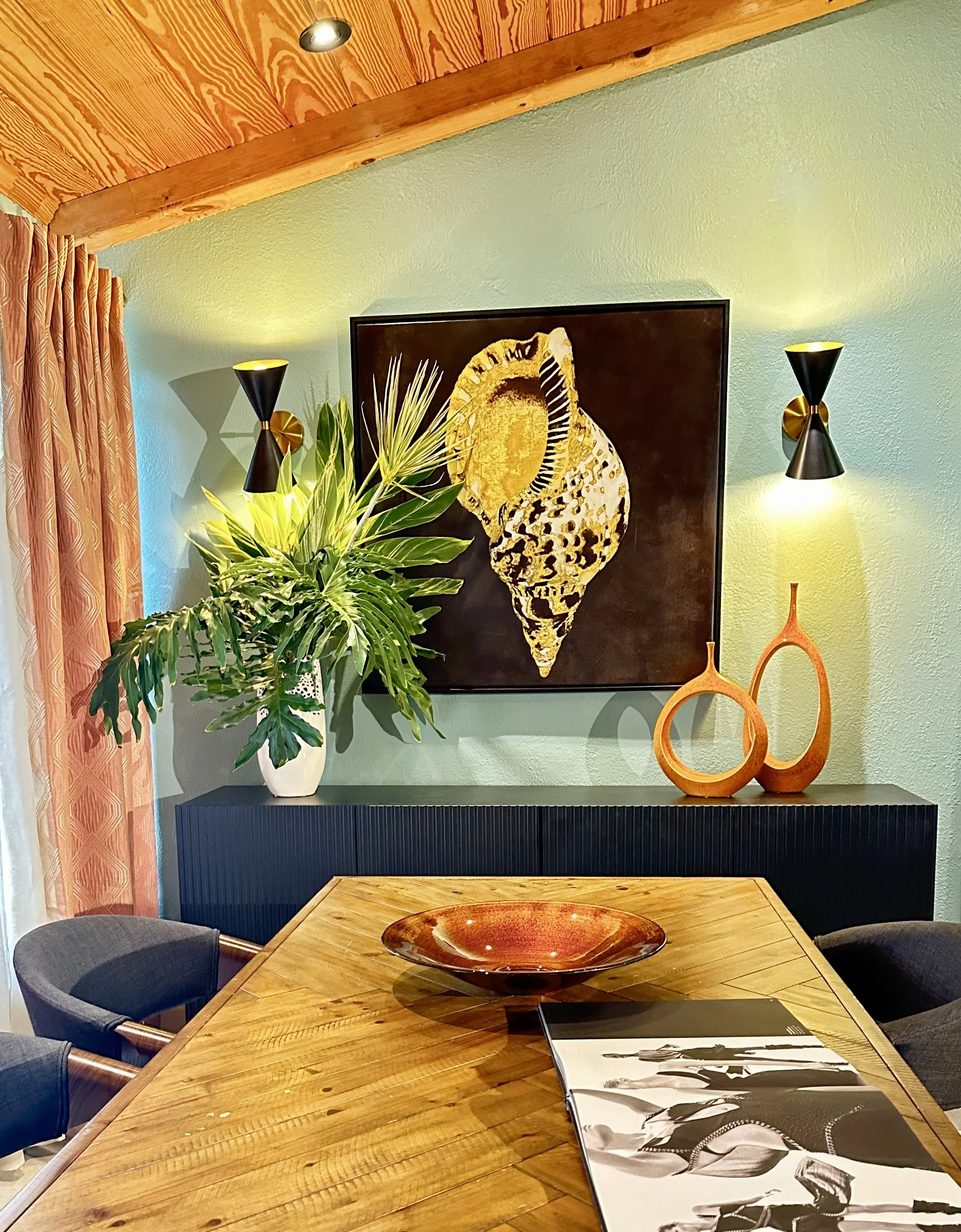 mid century modern interior design of dining area with wood ceiling in Fort Lauderdale