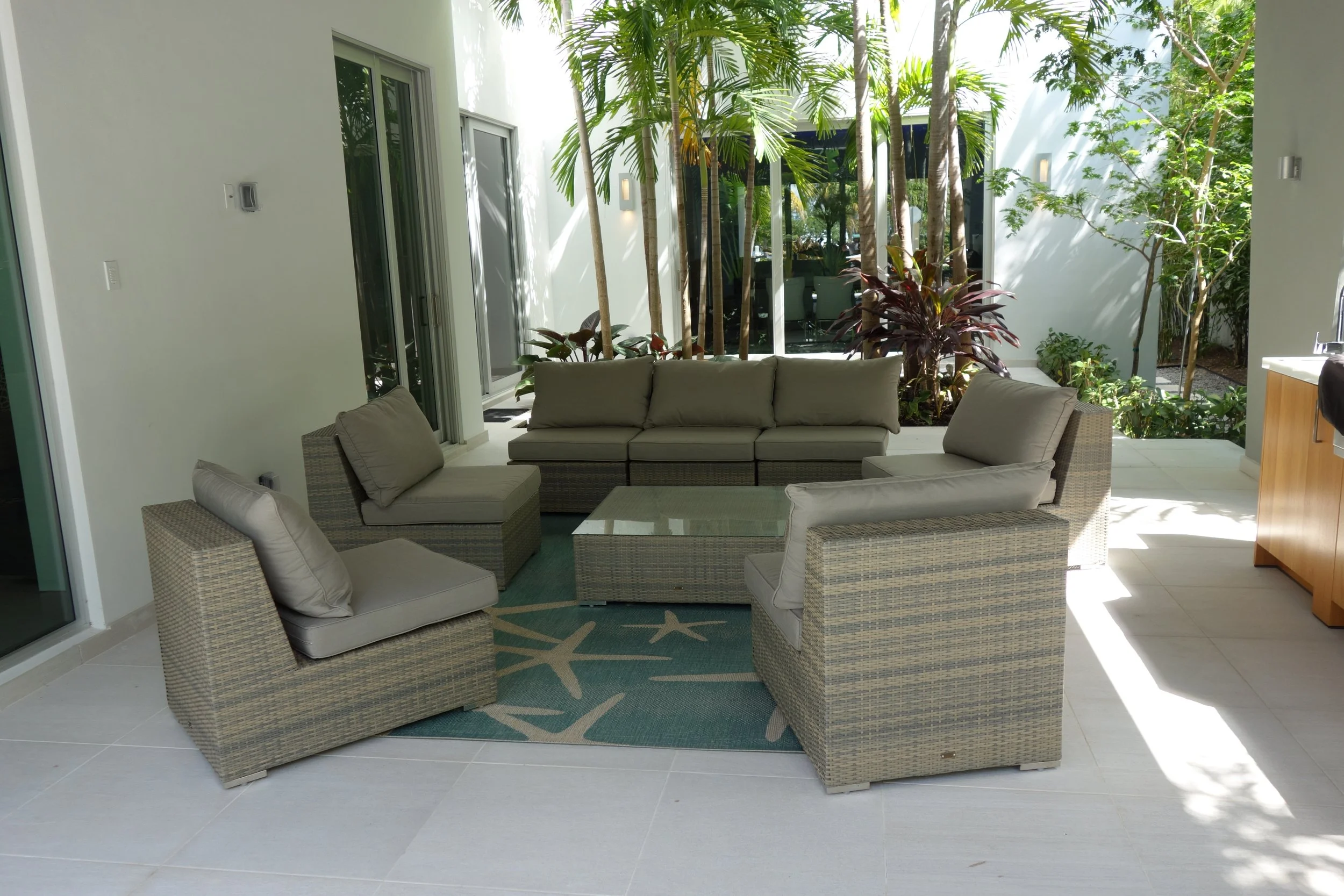 tropical patio seating before home remodel in Fort Lauderdale