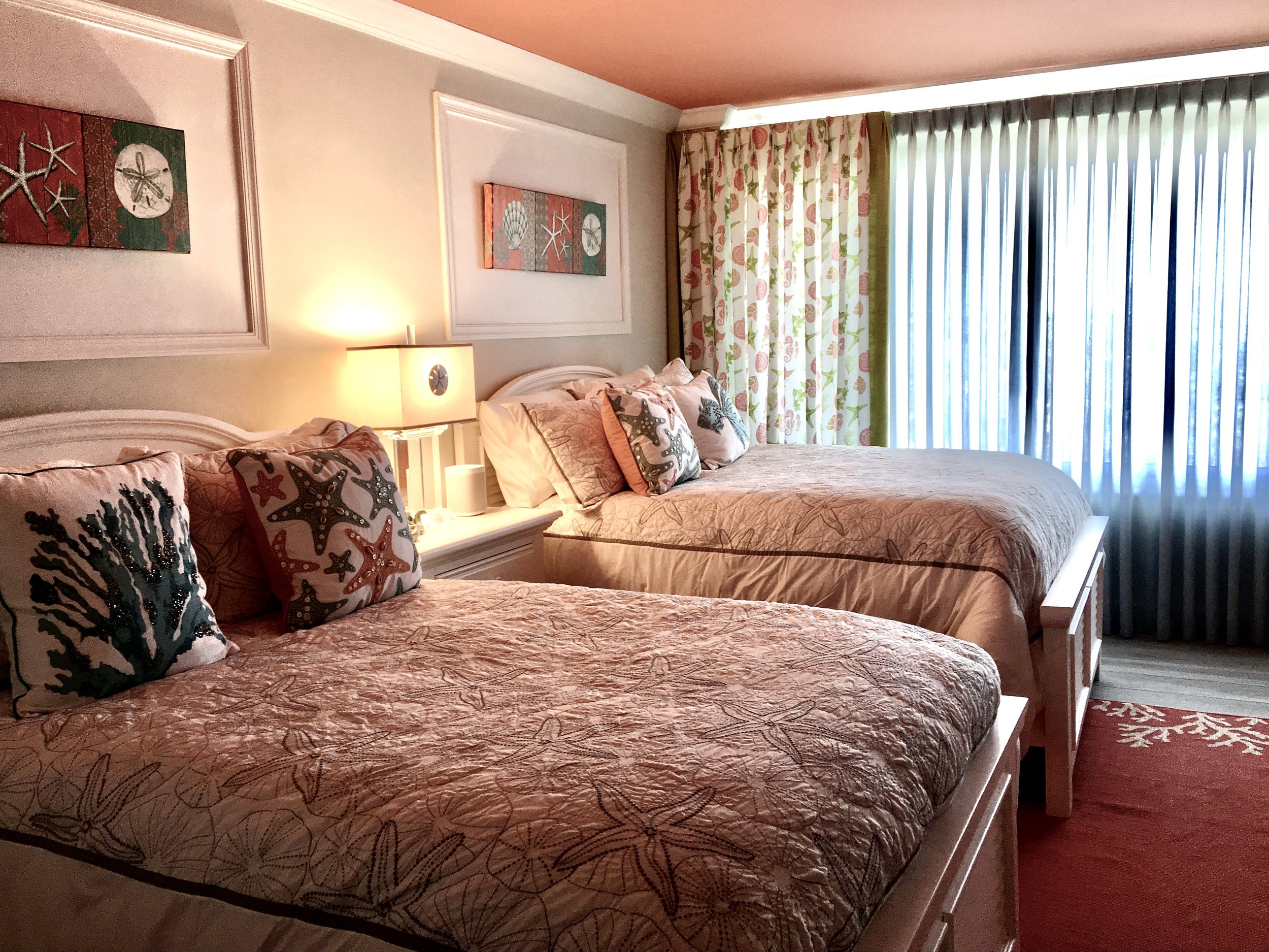 coastal tropical guest bedroom with colorful ceiling in Florida Keys
