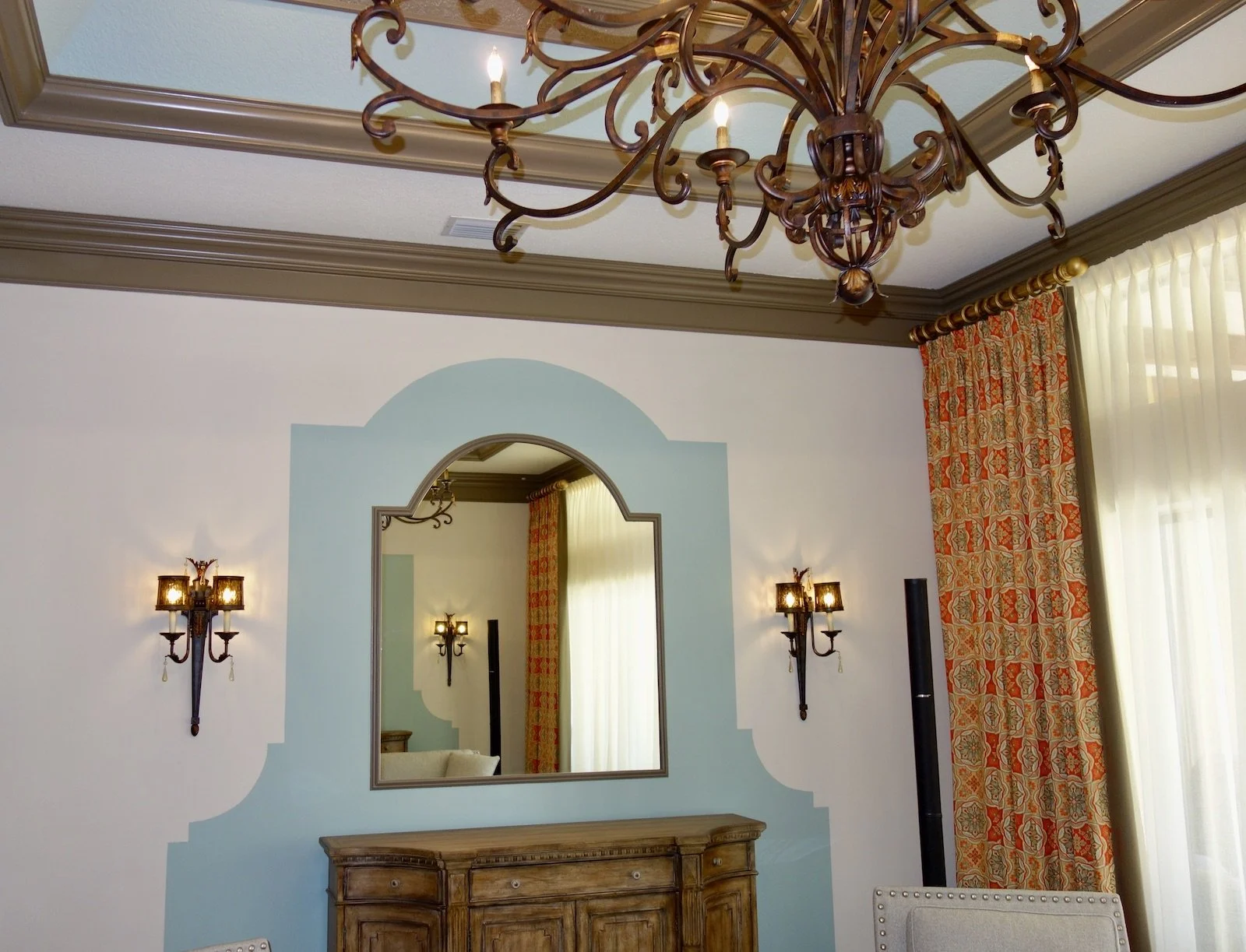 traditional style of this living room with custom mirror