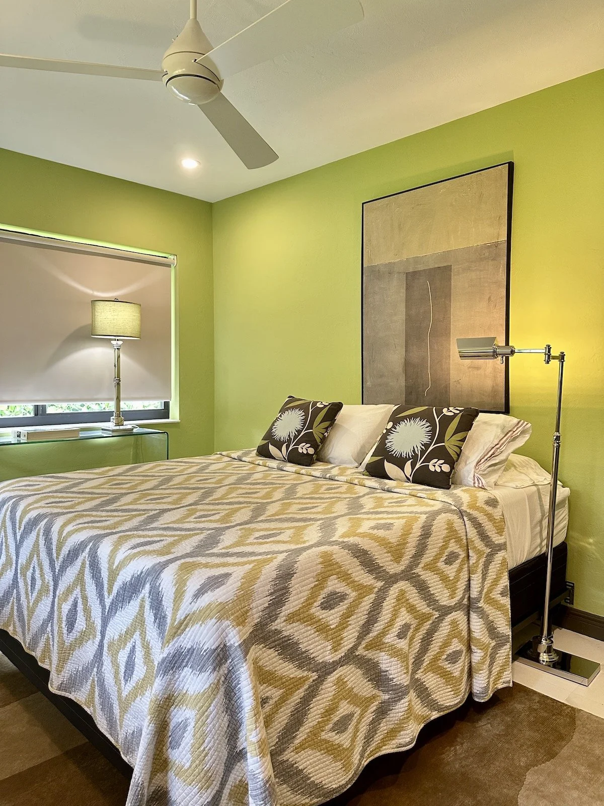 modern bedroom with lime green walls and dark brown moldings and doors