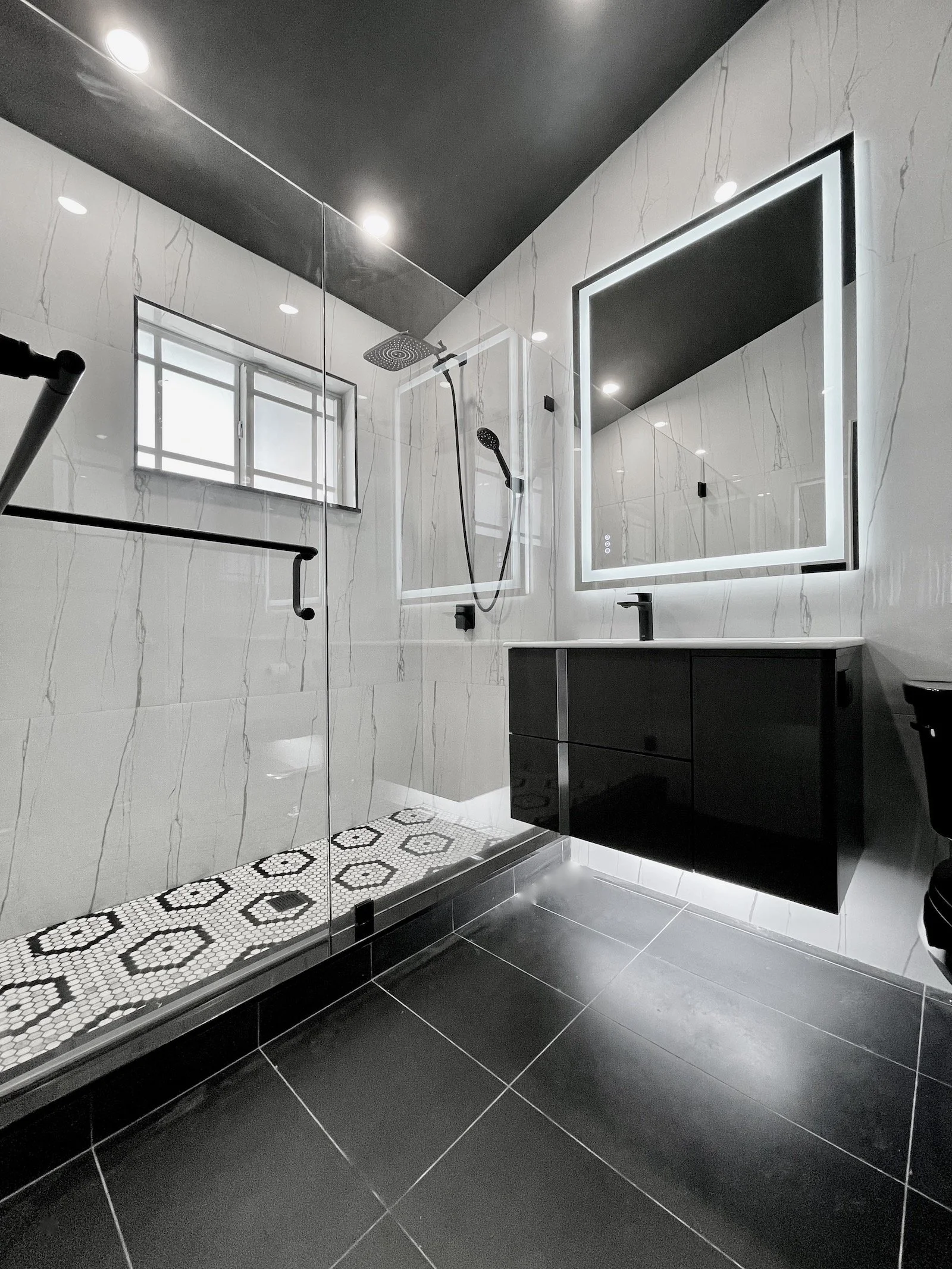 modern home remodeling of black and white bath room