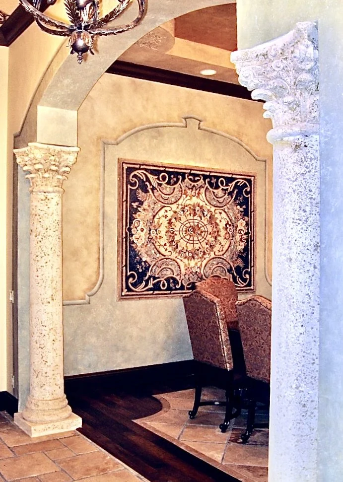 Mediterranean dining room with stone columns and Mosic wall mural in Windmill Ranches, Weston
