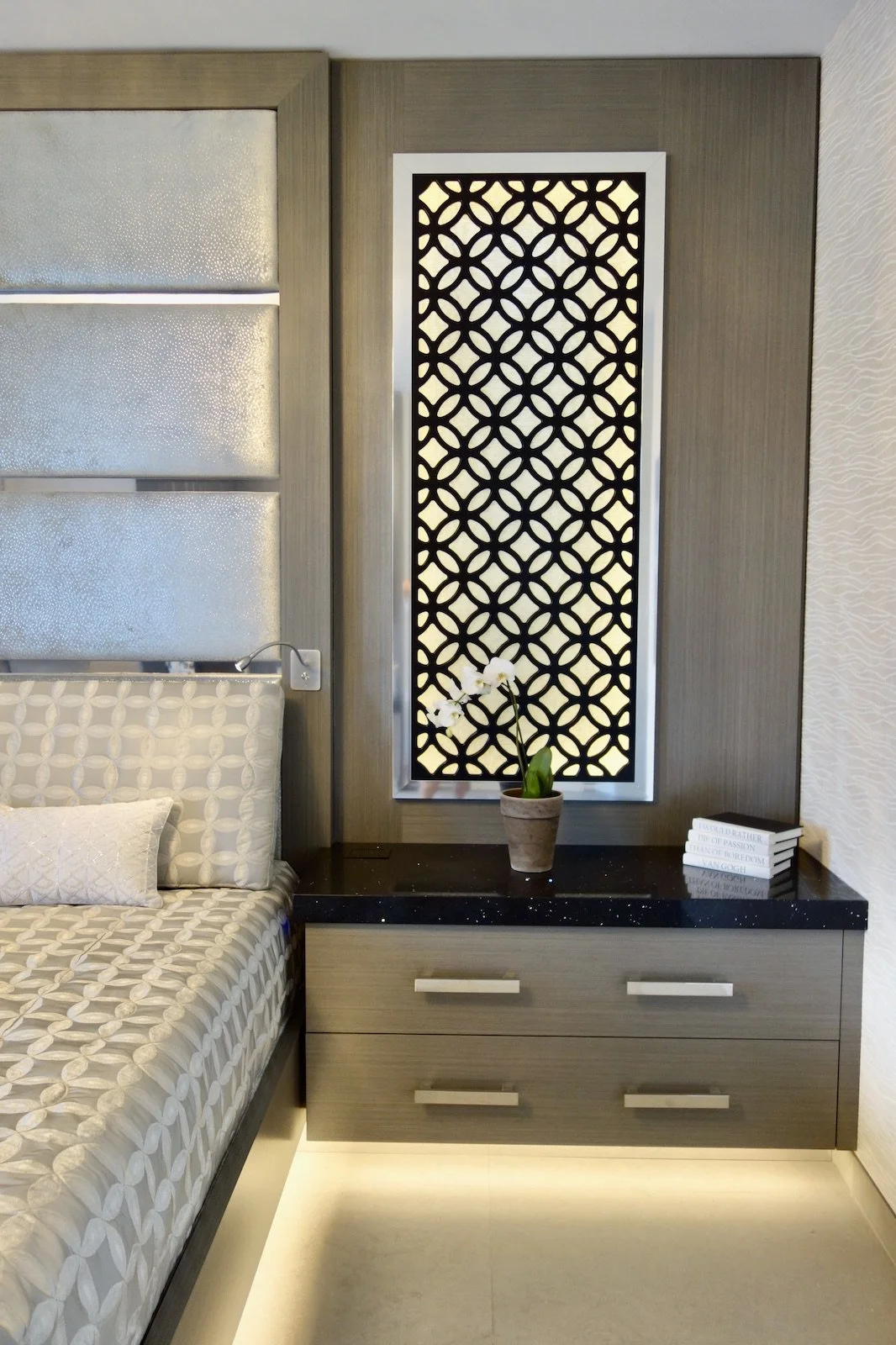 primary bedroom with custom built in bed, nightstands, and panel over side windows in Fort Lauderdale