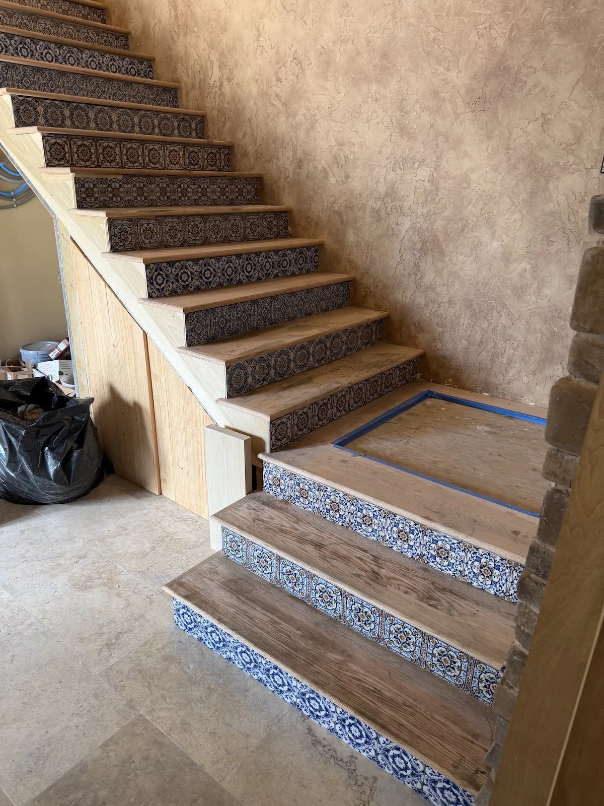 Mediterranean style staircase with wood treads and tile risers