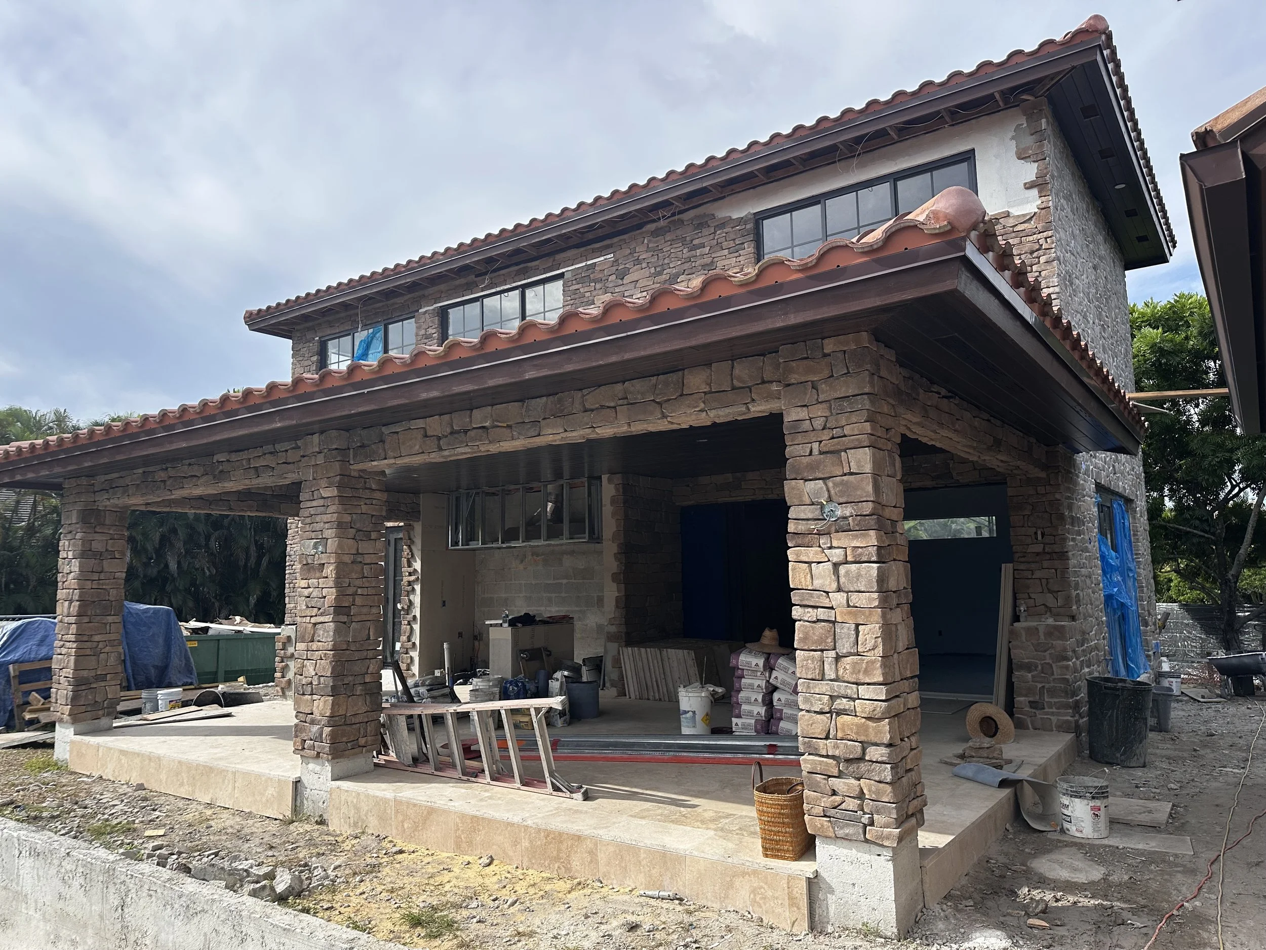 design-build of Mediterranean home with stone exterior walls in Boca Raton