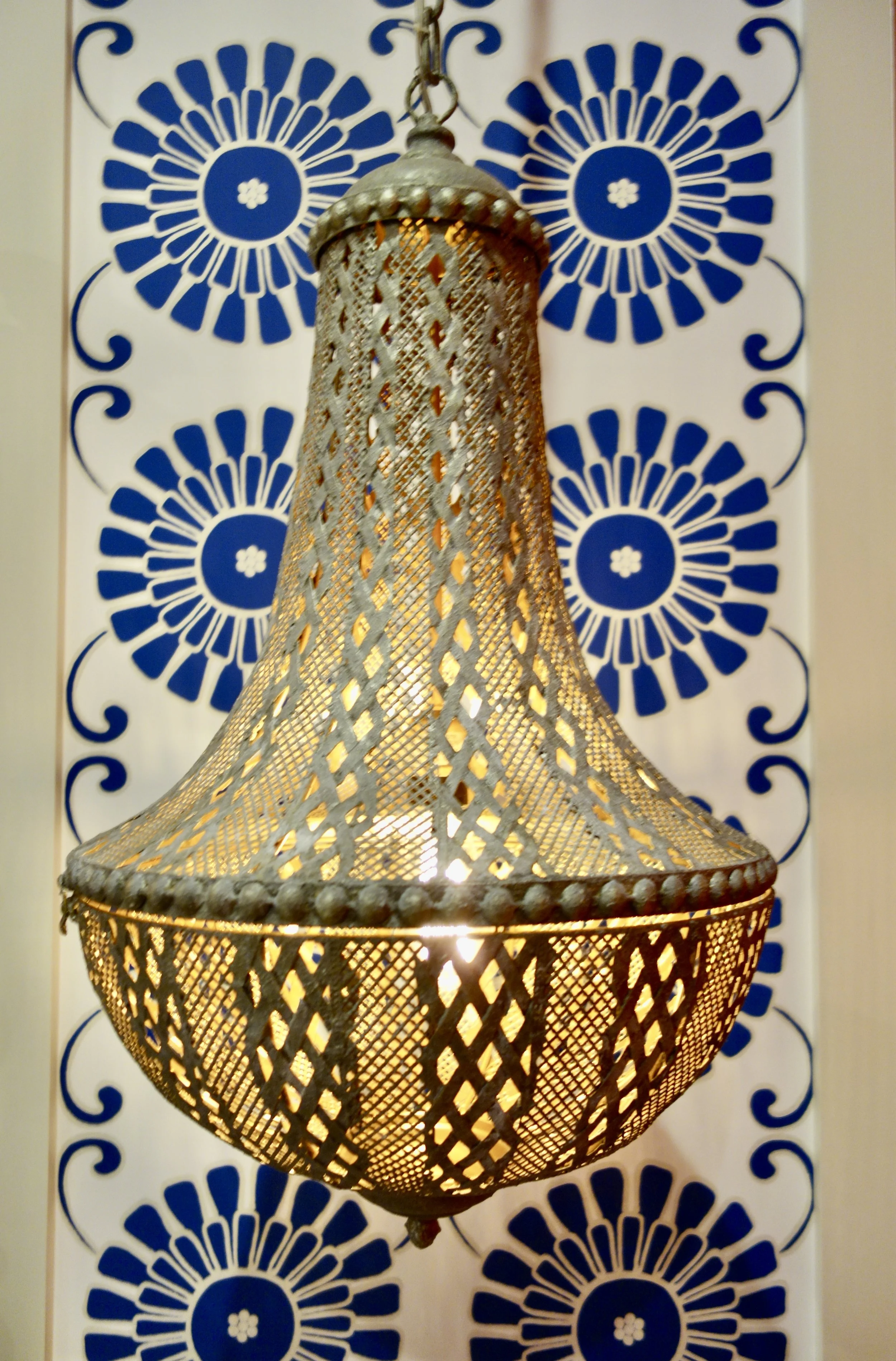 silver rustic hanging light with Batik fabric on Las Olas Blvd.