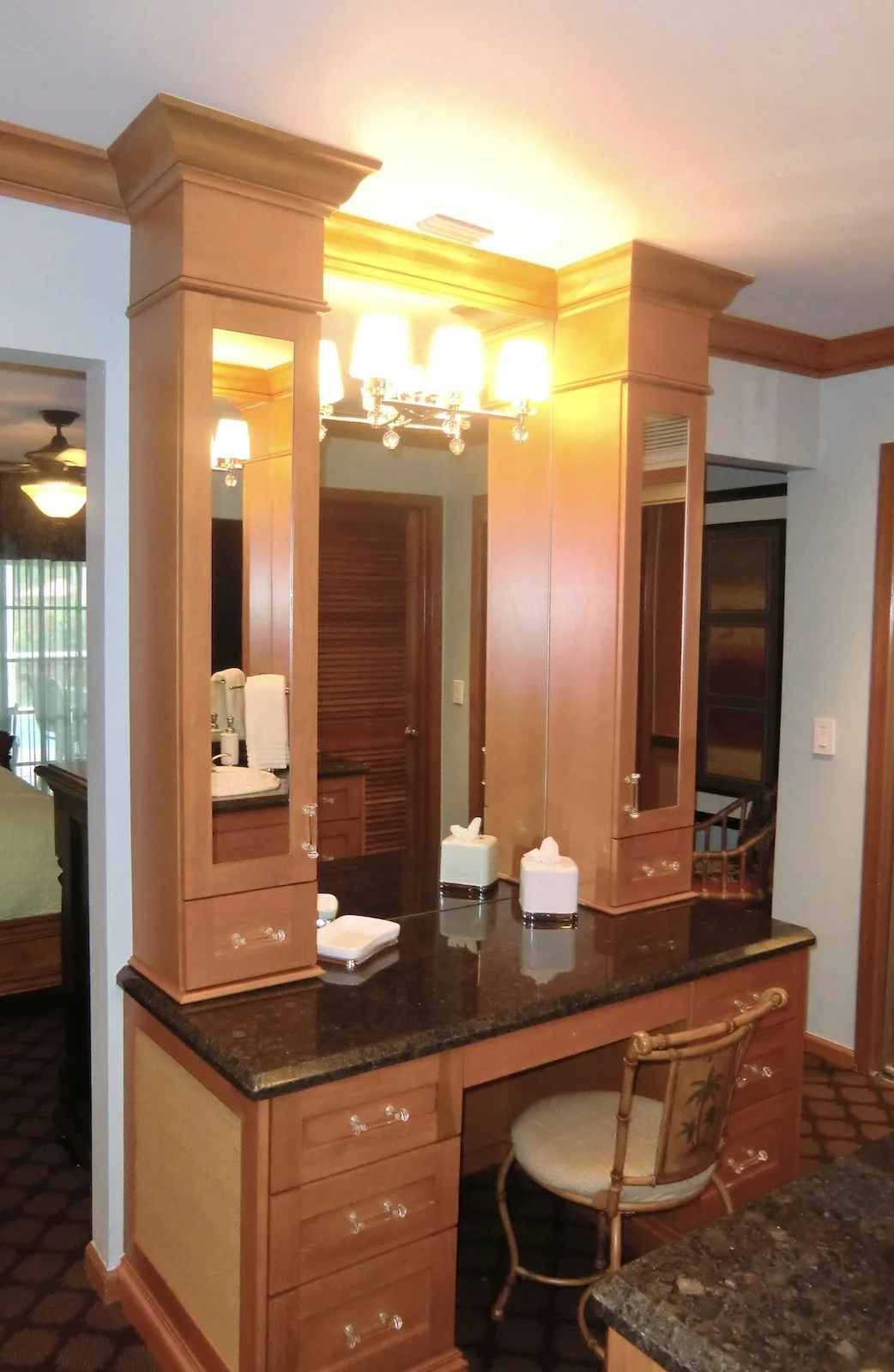 traditional coastal bathroom custom cabinetry vanity area with flanking upper cabinets to ceiling with crown molding in Delray Beach