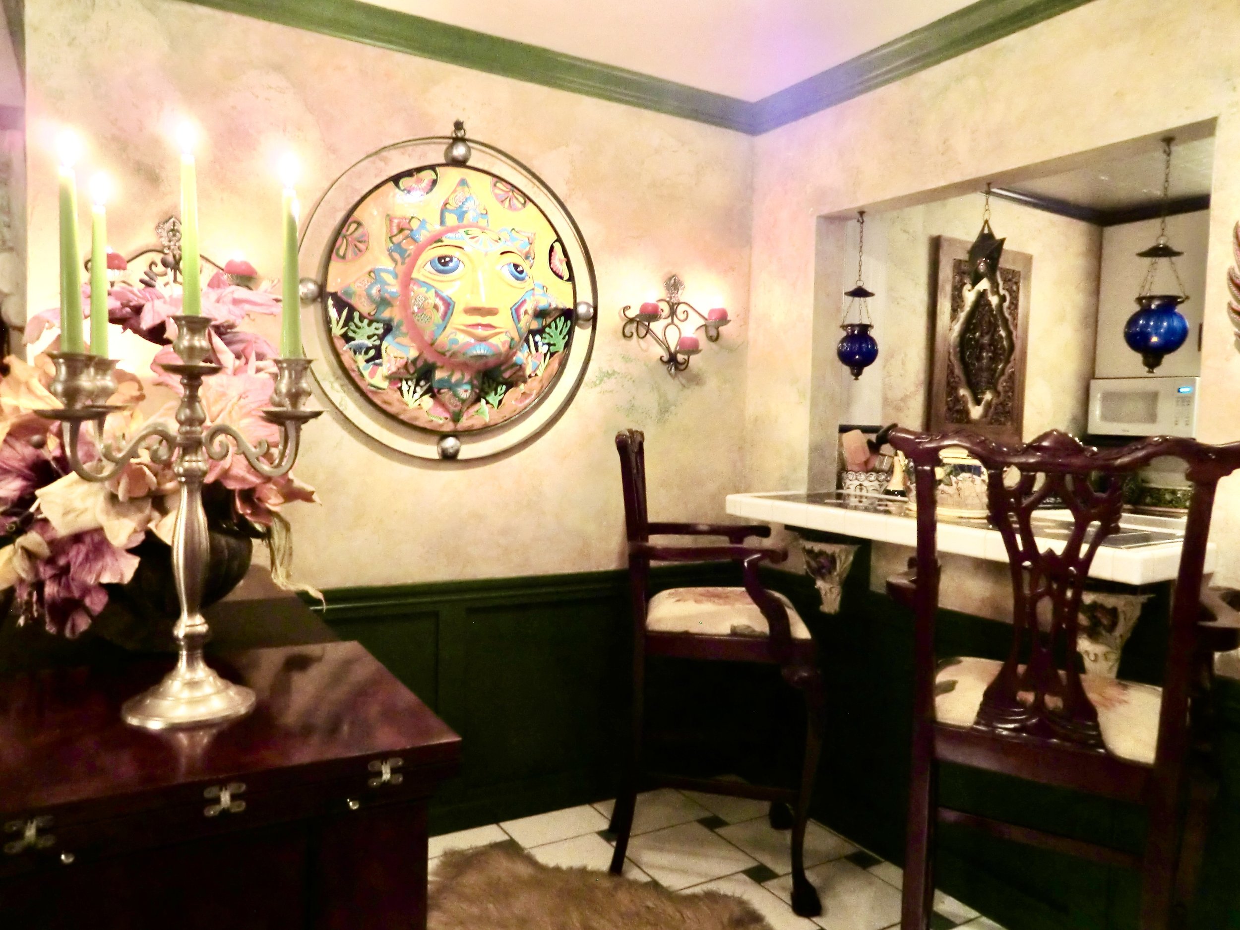 Mediterranean style colorful living room with ceramic Mexican sun face in Fort Lauderdale