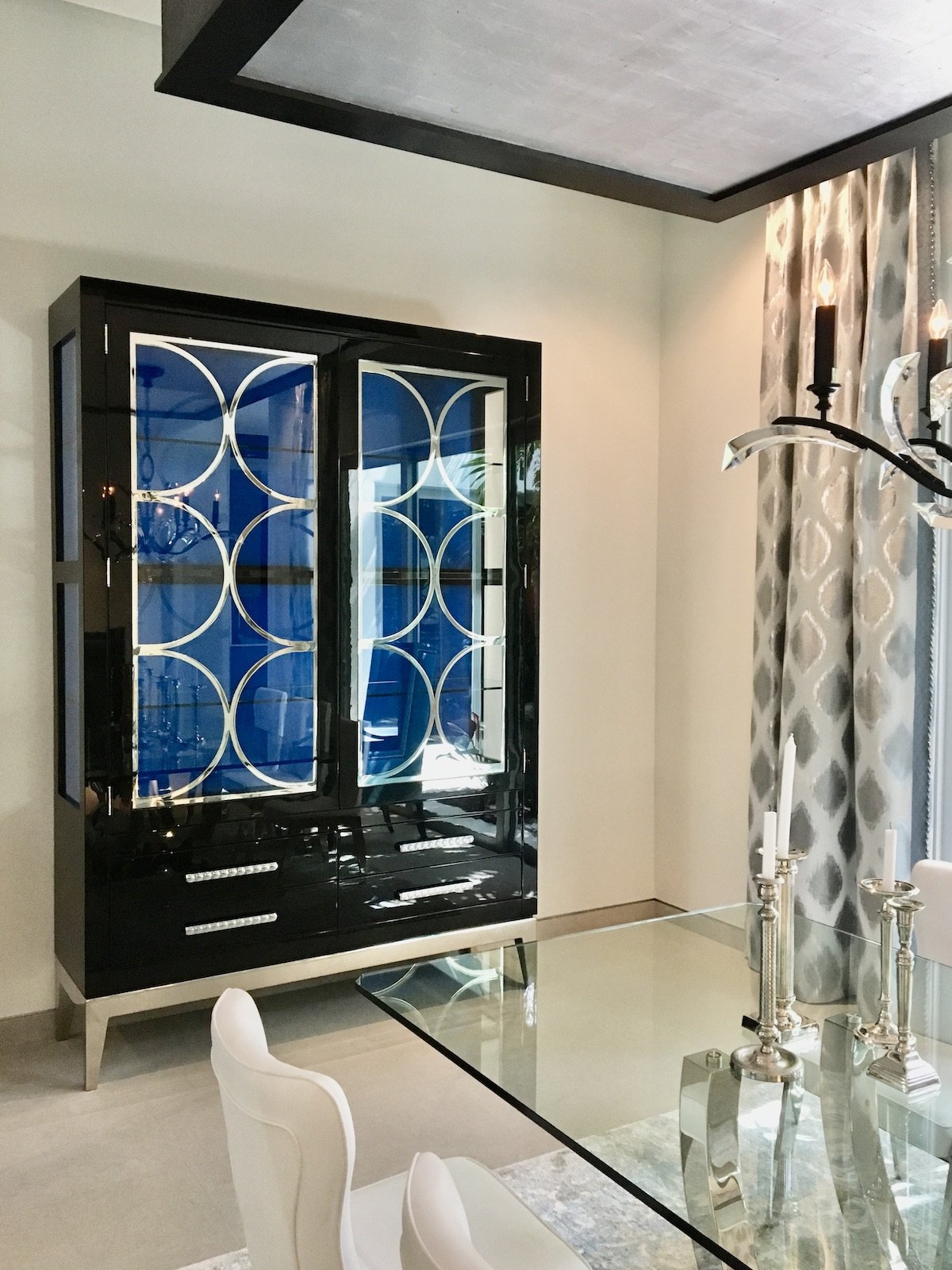Dining room with custom hutch in gloss black and silver metal in Fort Lauderdale