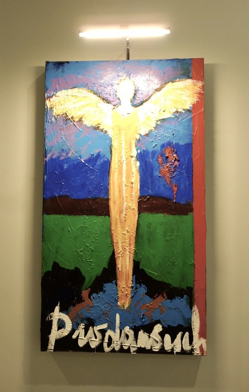 modern angel artwork in yellow, red, green, and blue