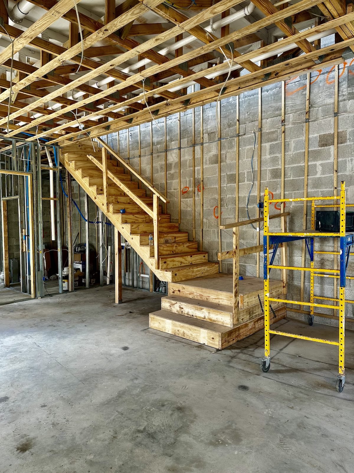 before picture of Mediterranean stye staircase in Fort Lauderdale with wrought iron railing